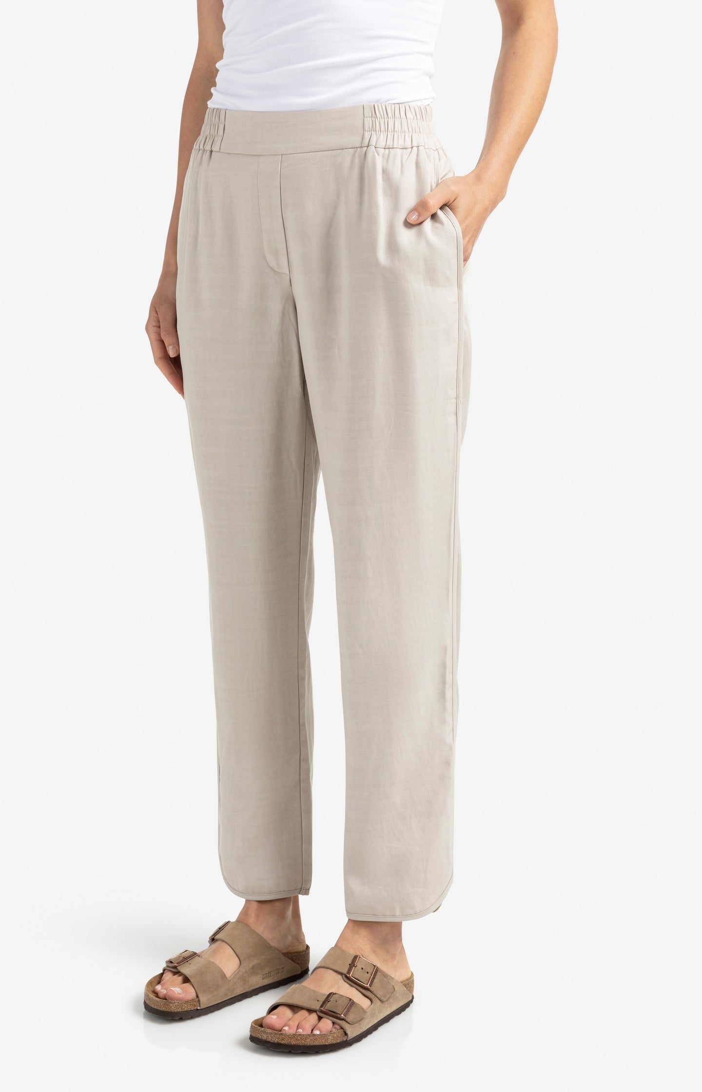 Woven trousers with elastic waistband and curved hem