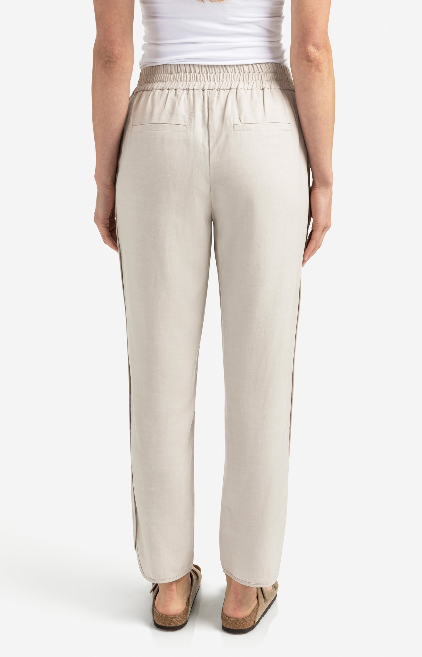 Woven trousers with elastic waistband and curved hem
