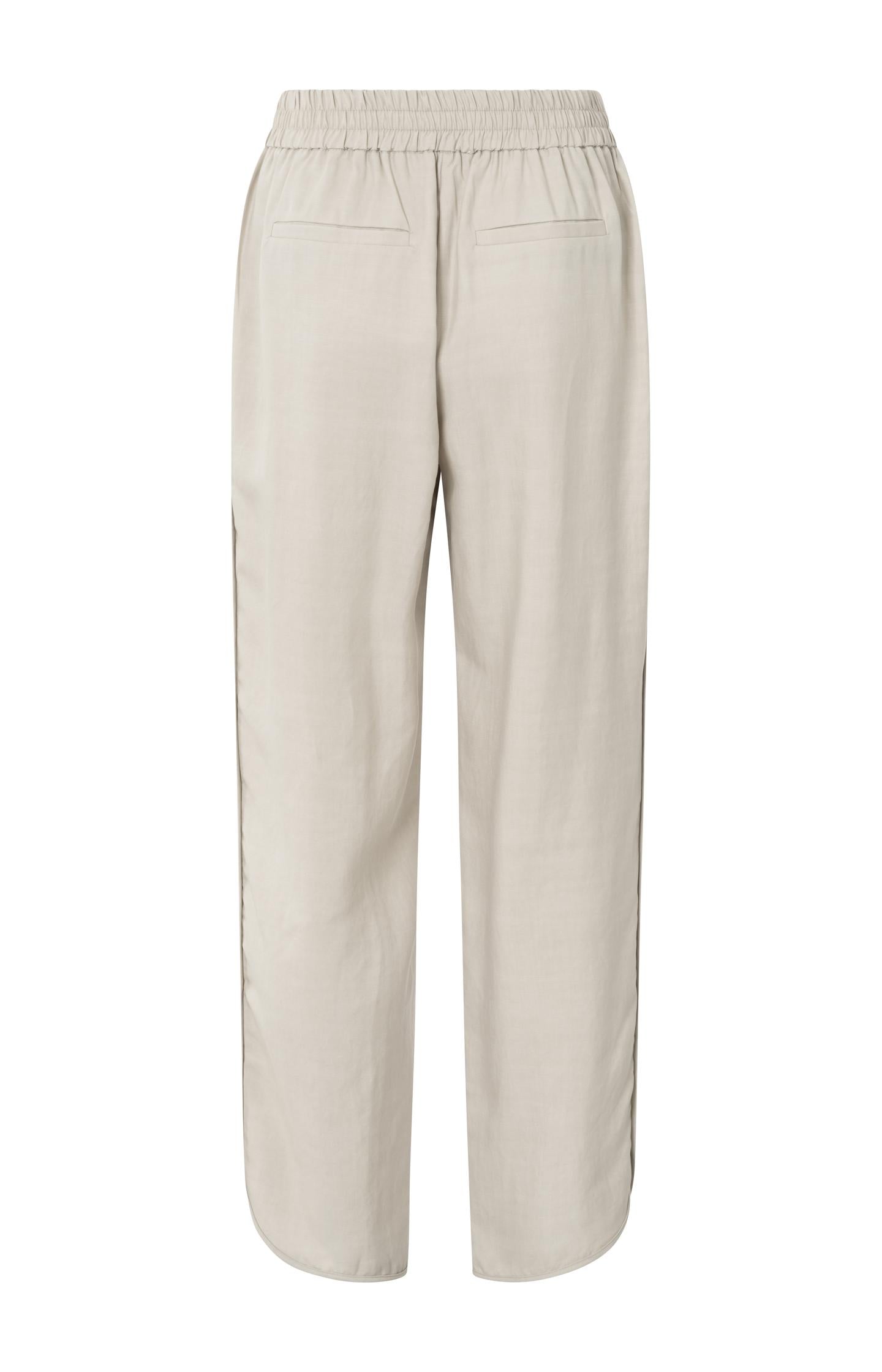 Woven trousers with elastic waistband and curved hem