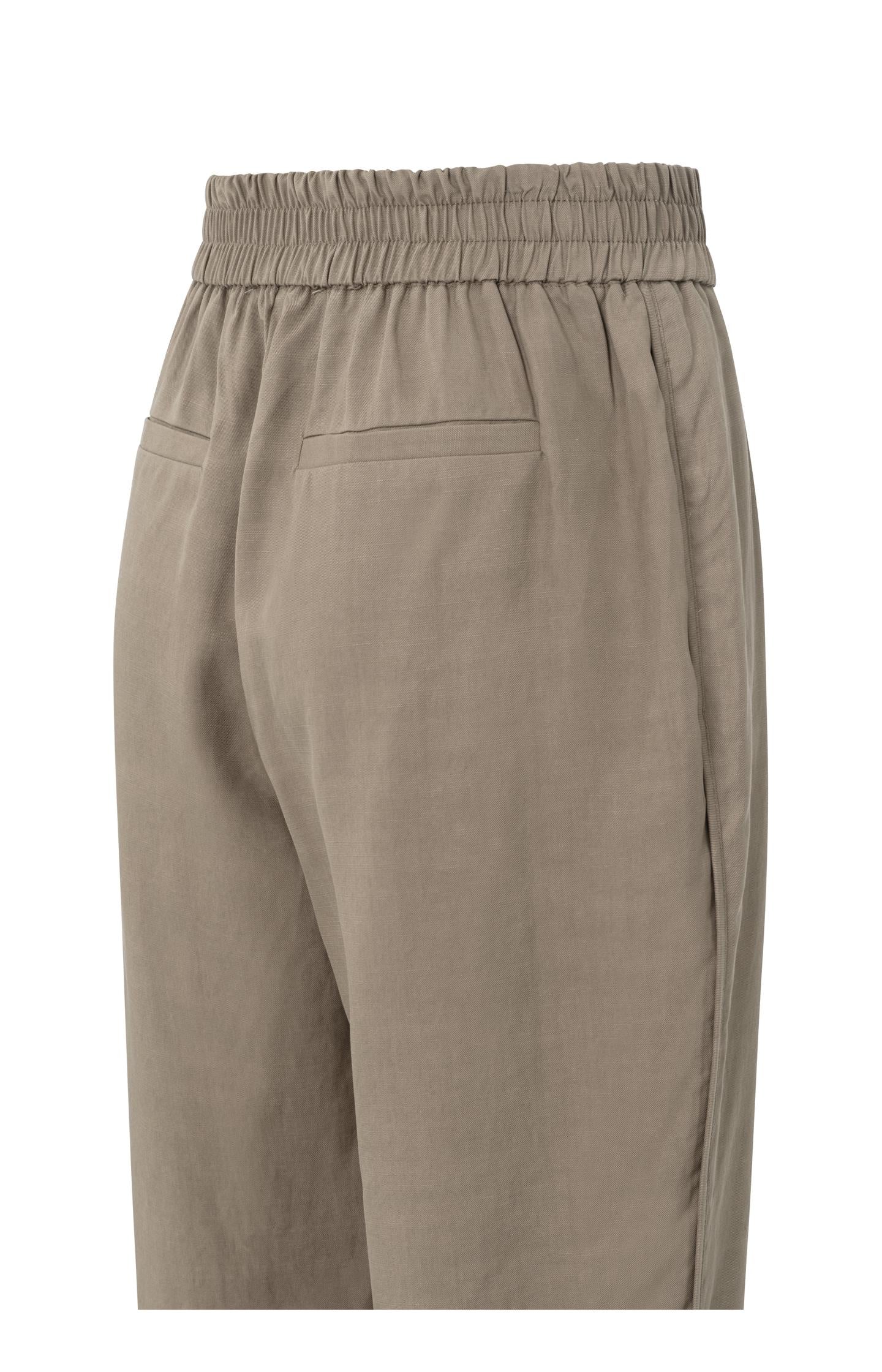 Woven trousers with elastic waistband and curved hem