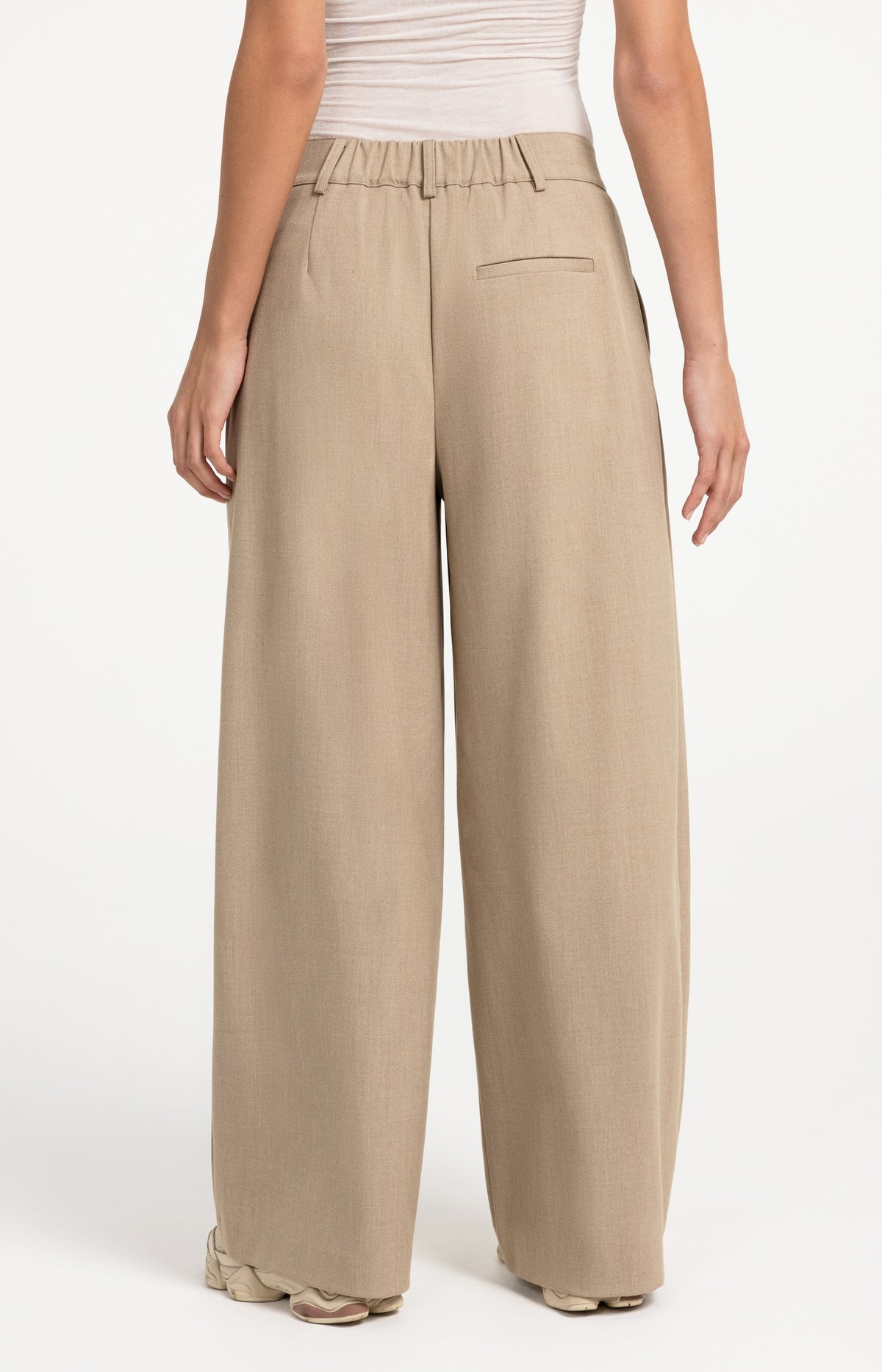 Woven trousers with wide legs and asymmetrical closure