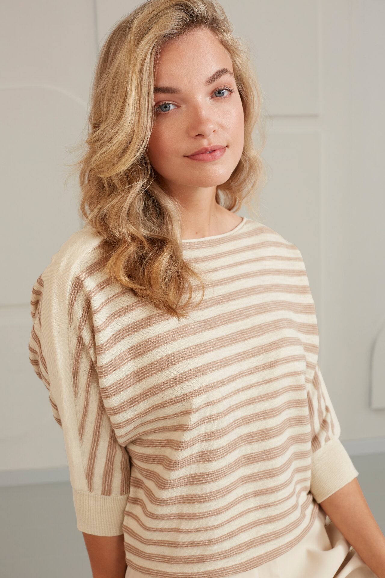 Batwing sweater with boatneck, half long sleeves and stripes