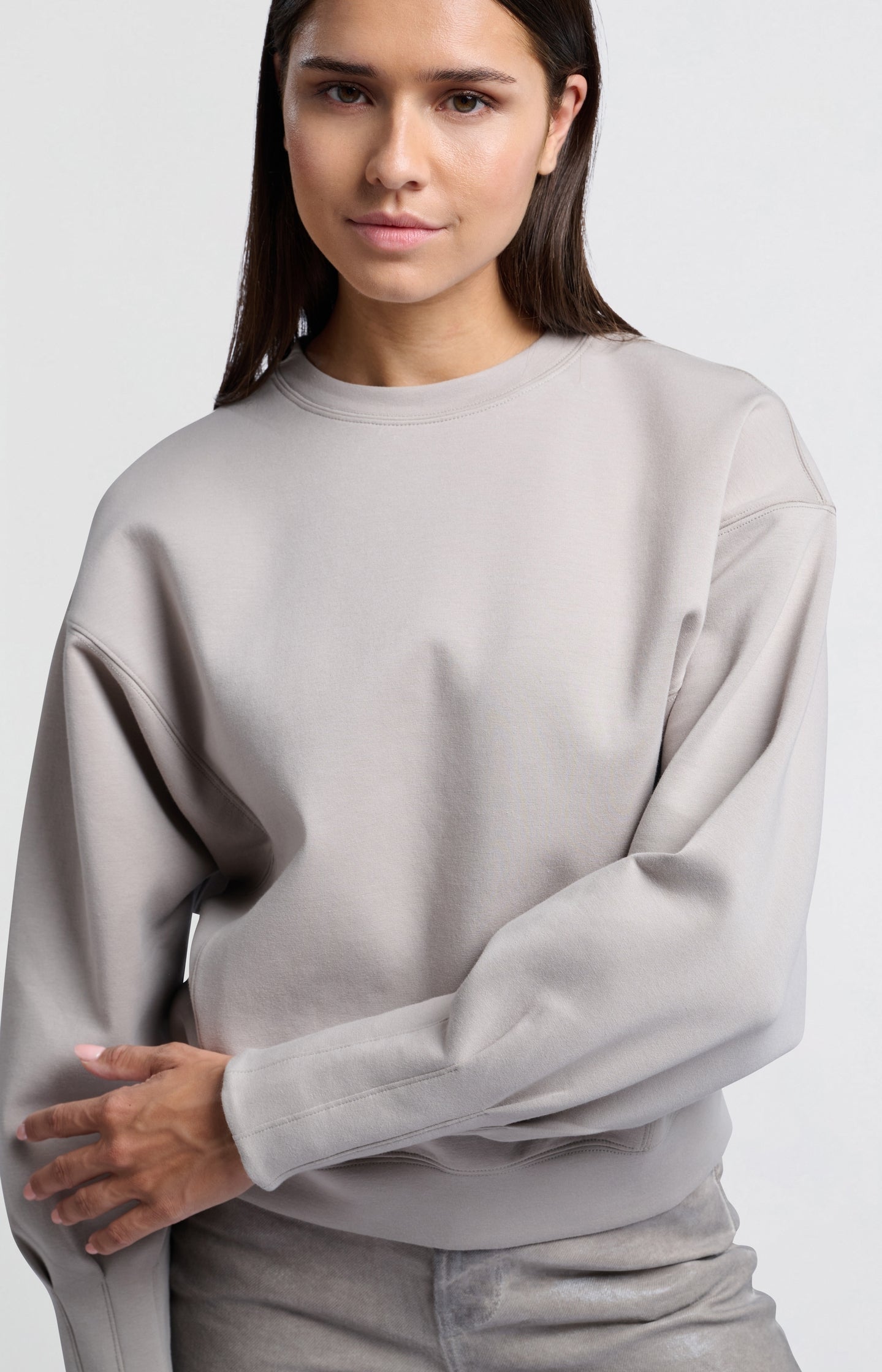 Beige sweatshirt with pleated detail on long sleeves