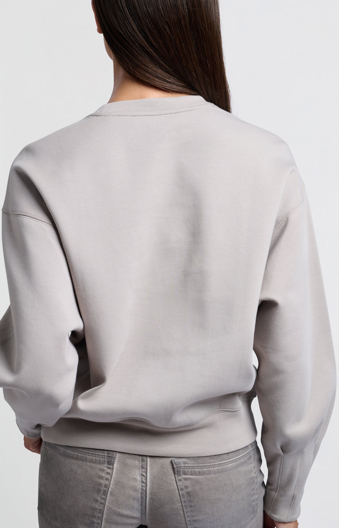 Beige sweatshirt with pleated detail on long sleeves