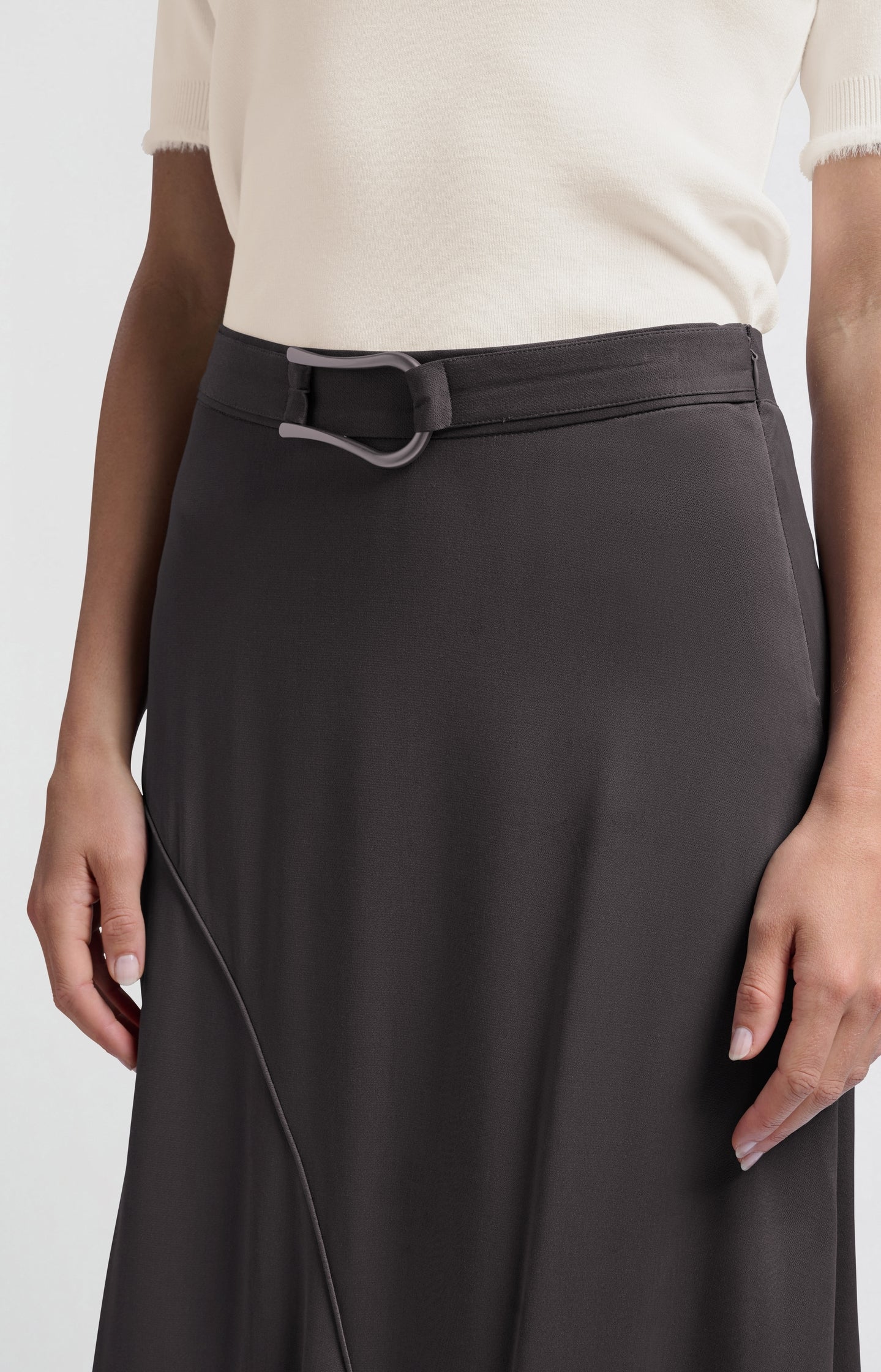 Black asymmetrical midi skirt with buckle detail