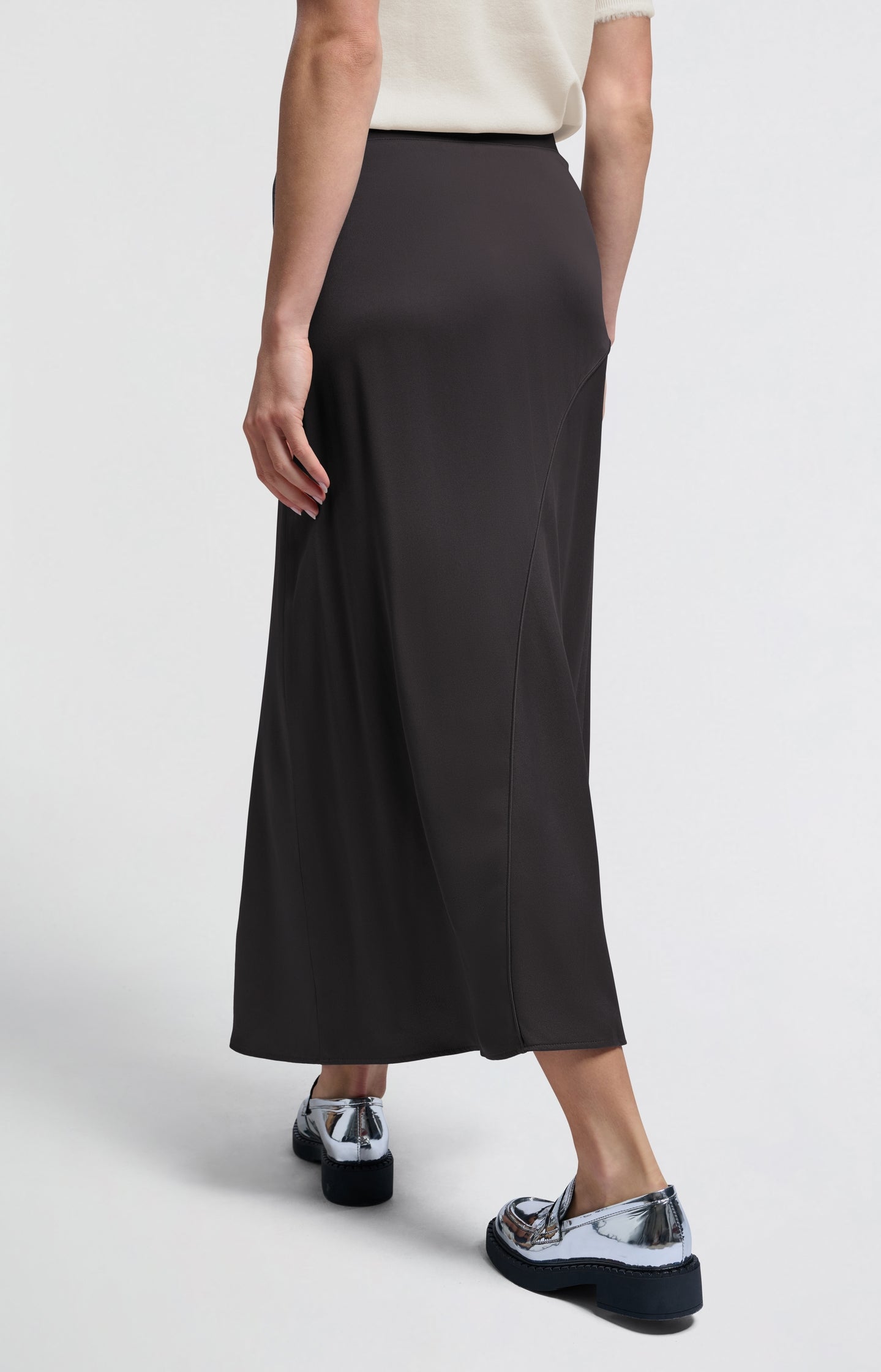 Black asymmetrical midi skirt with buckle detail