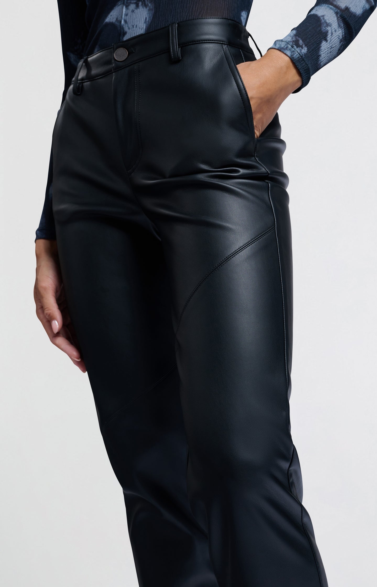 Black faux leather pants with high waist and straight legs