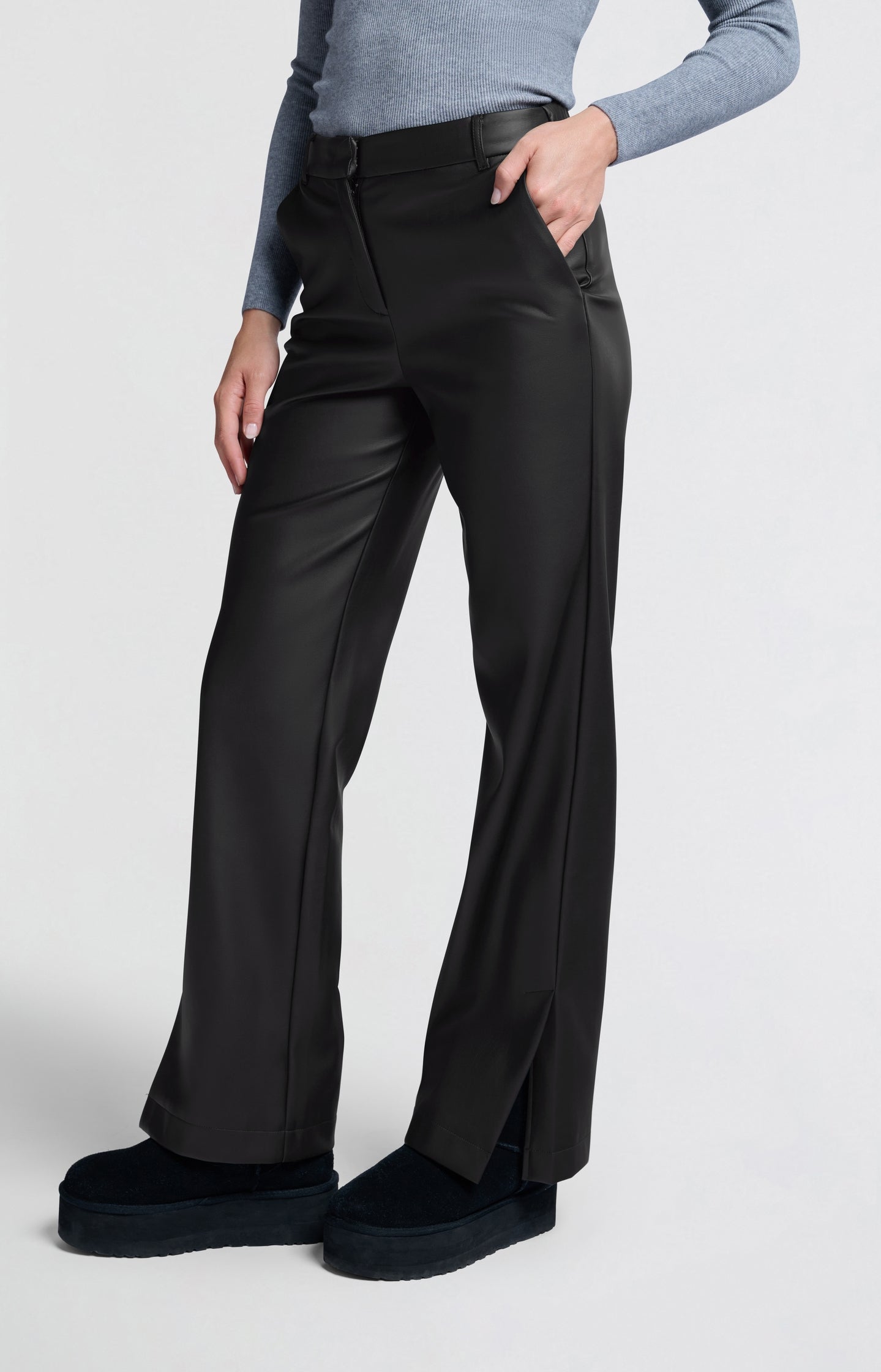 Black faux leather trousers with wide legs