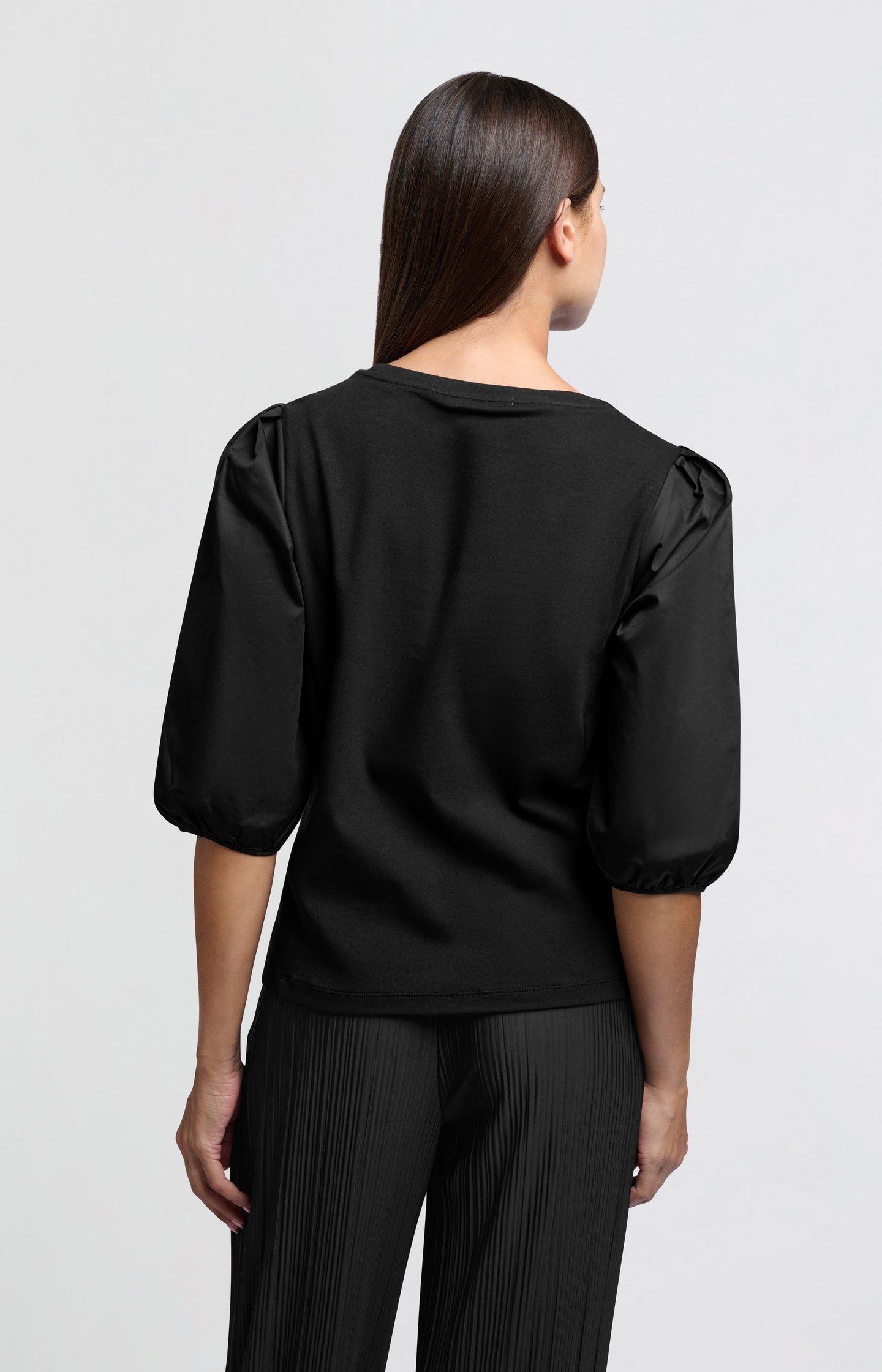 Black jersey top with puffed sleeves