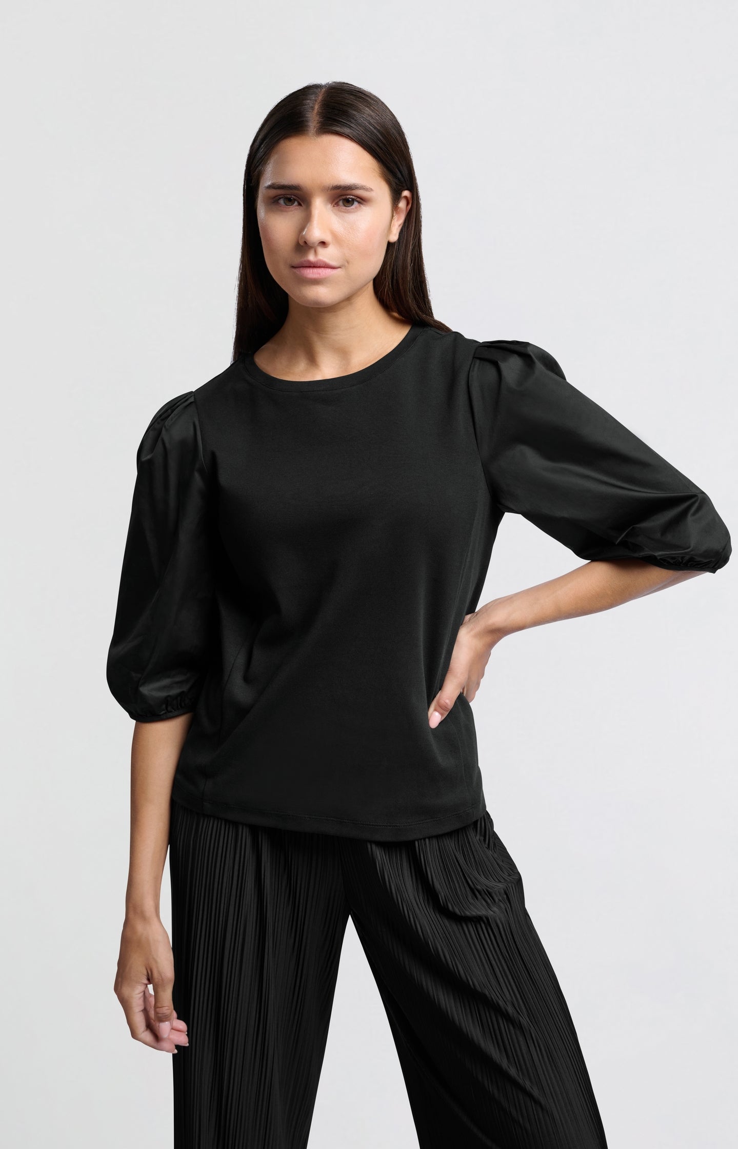 Black jersey top with puffed sleeves