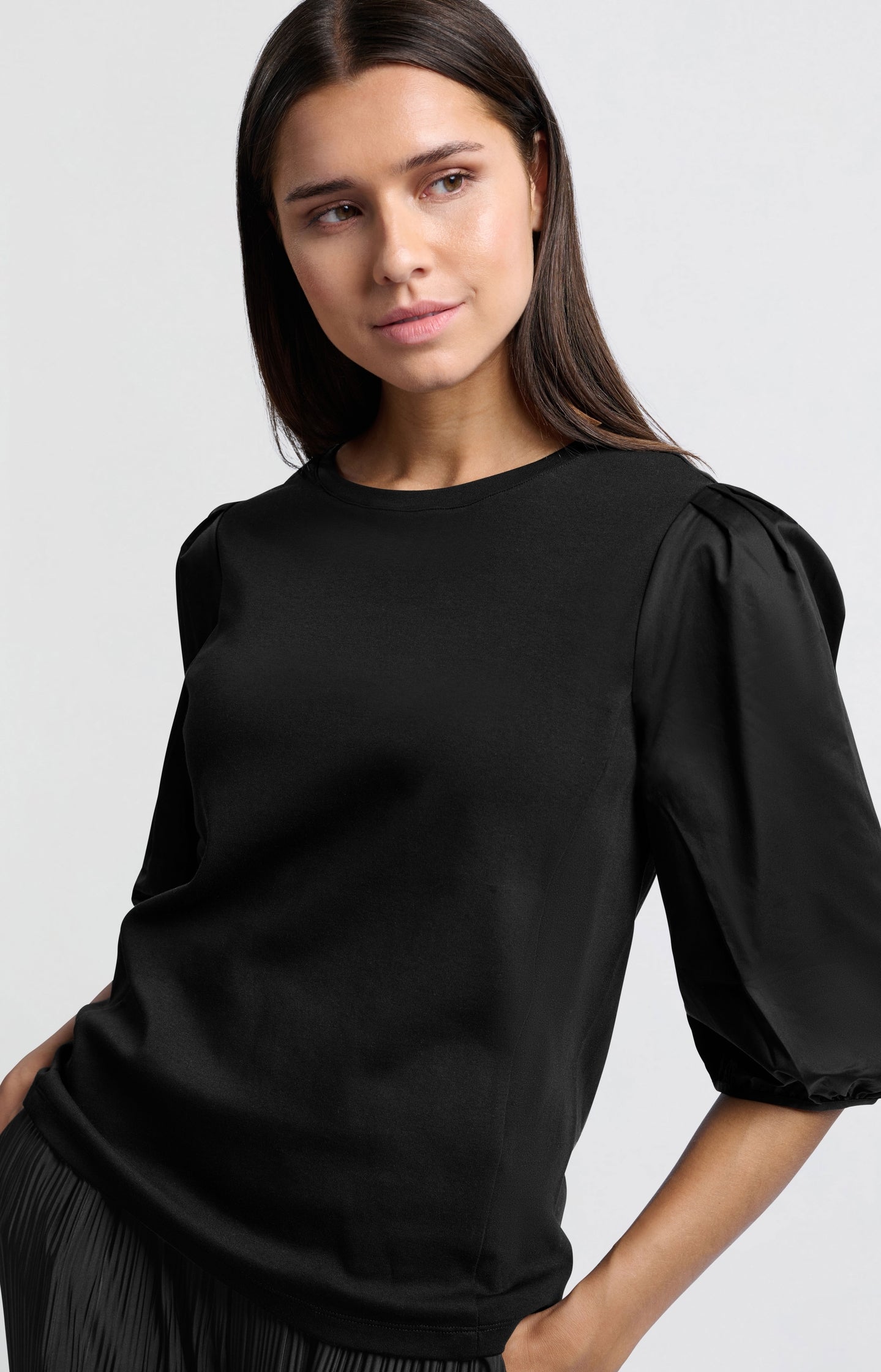 Black jersey top with puffed sleeves