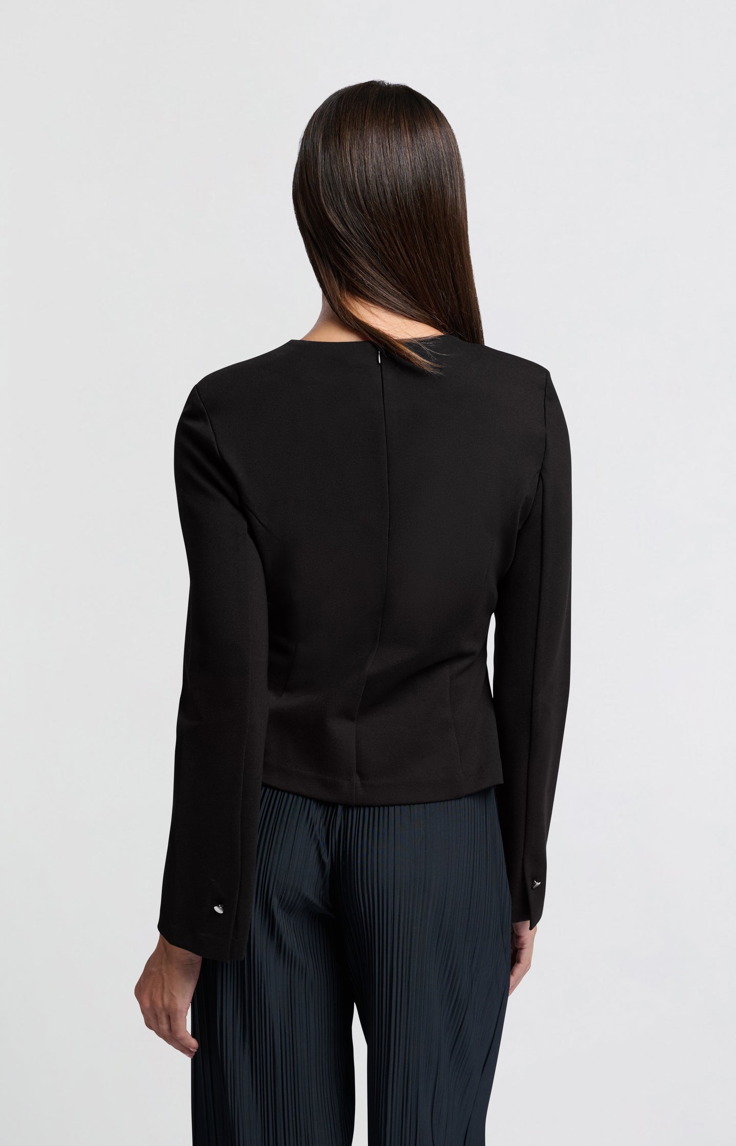 Black jersey top with slit detail and long sleeves