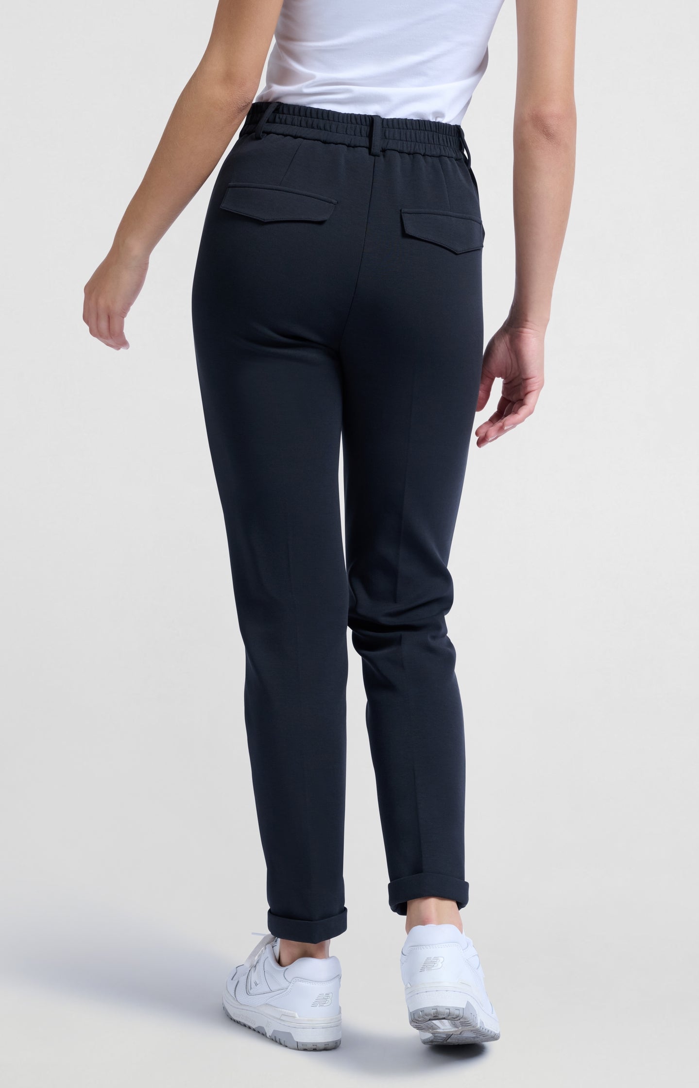 Black scuba trousers with straight legs and flap pockets