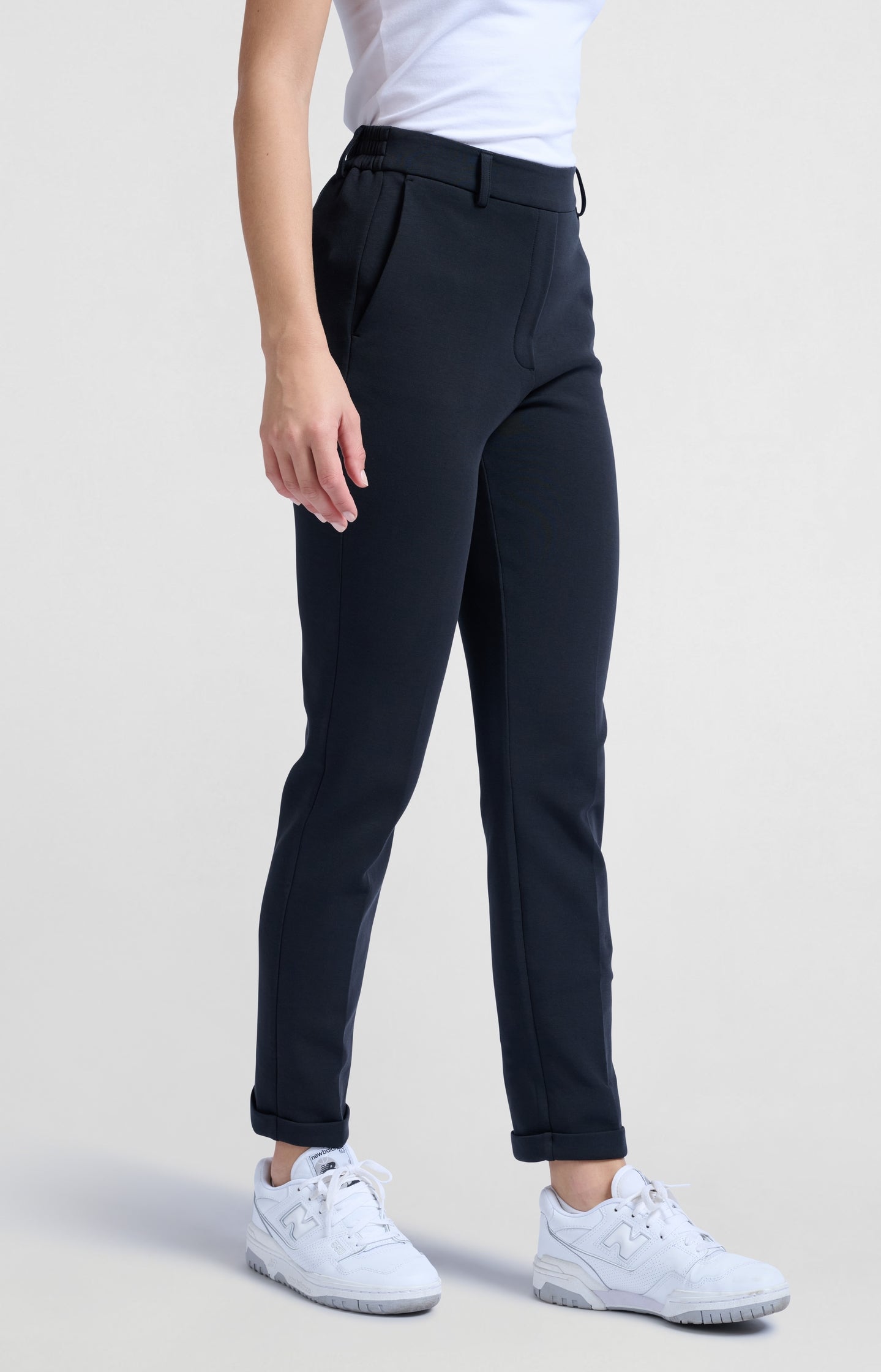 Black scuba trousers with straight legs and flap pockets