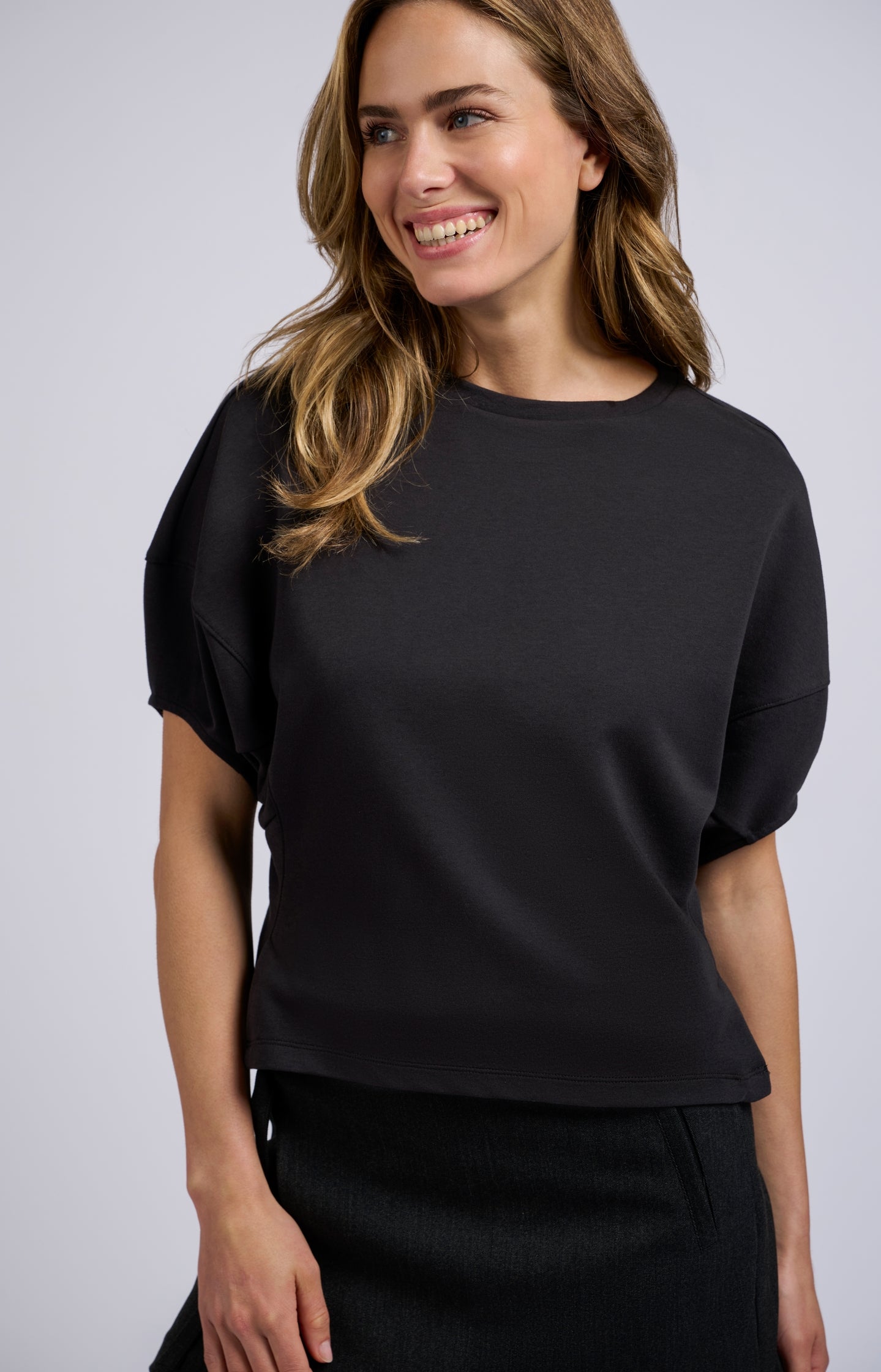 Black top with half puff sleeves and a round neck