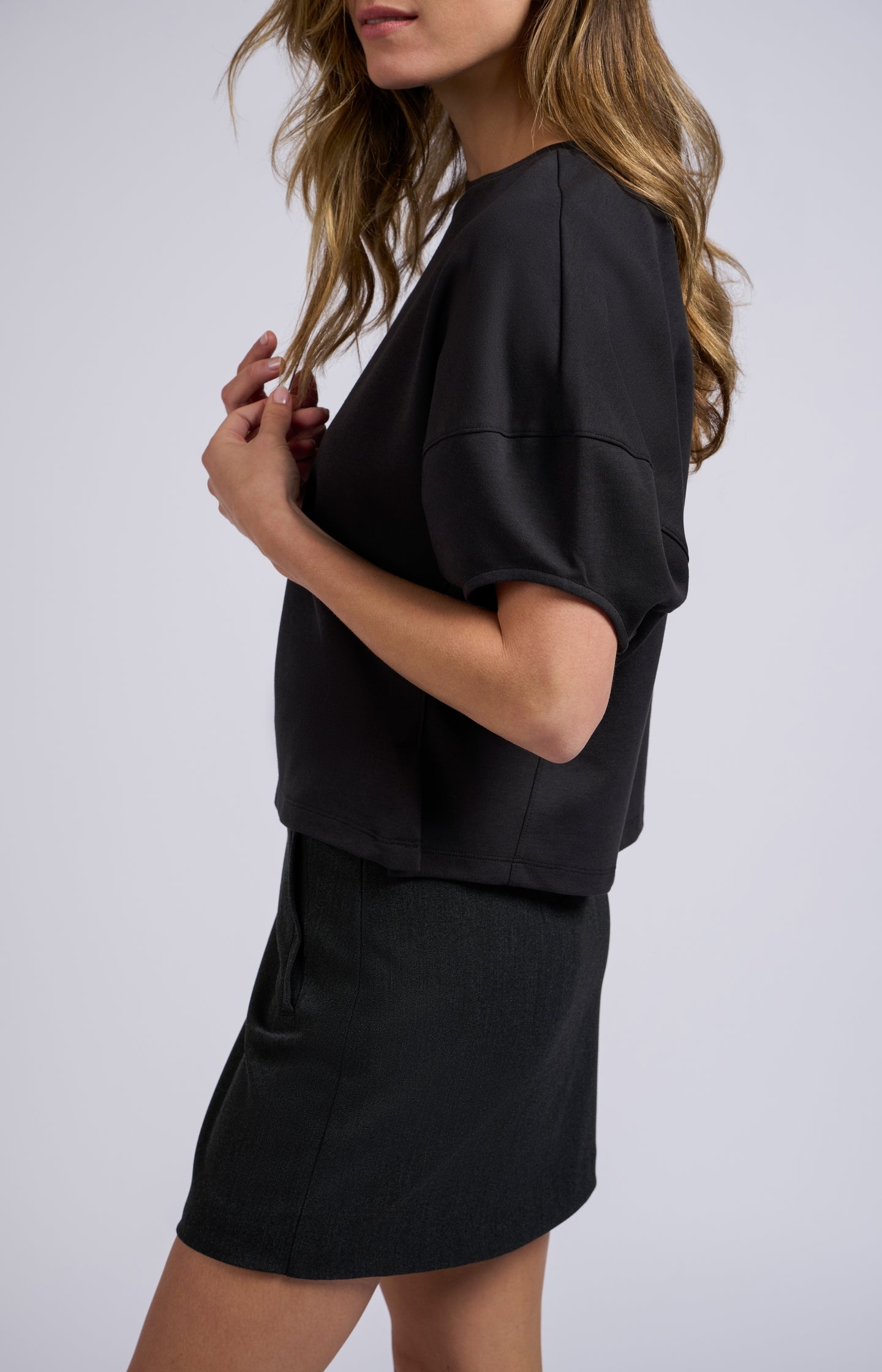 Black top with half puff sleeves and a round neck