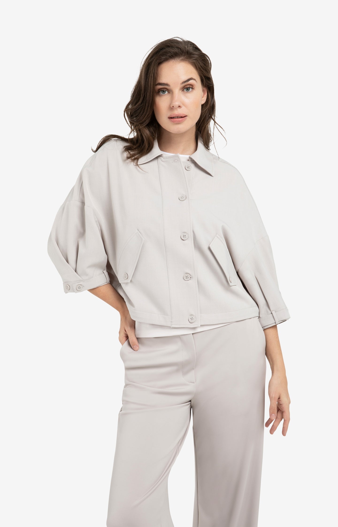 Blouse jacket with adjustable waistband and pockets