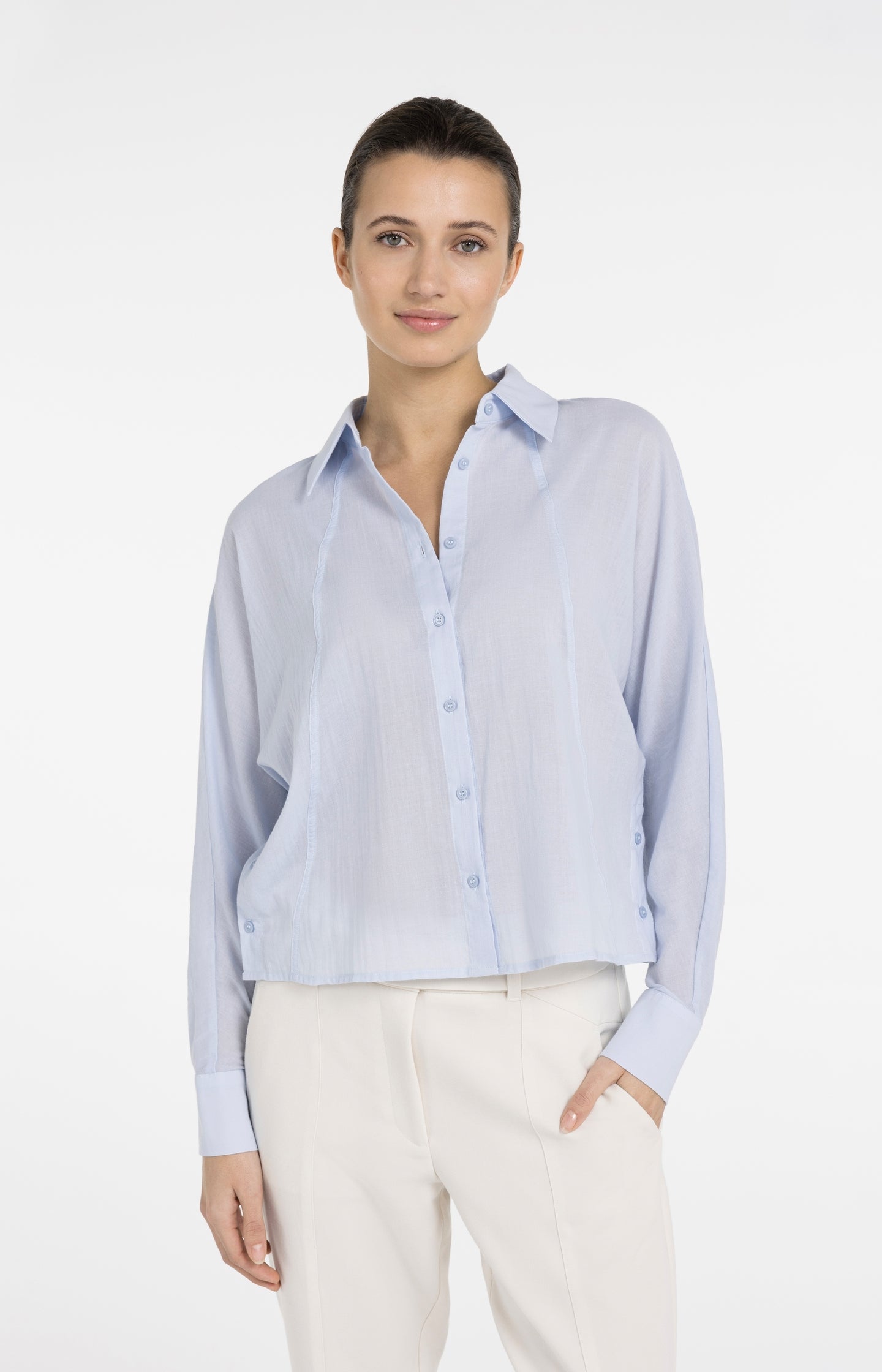 Blouse with angled seams and button details