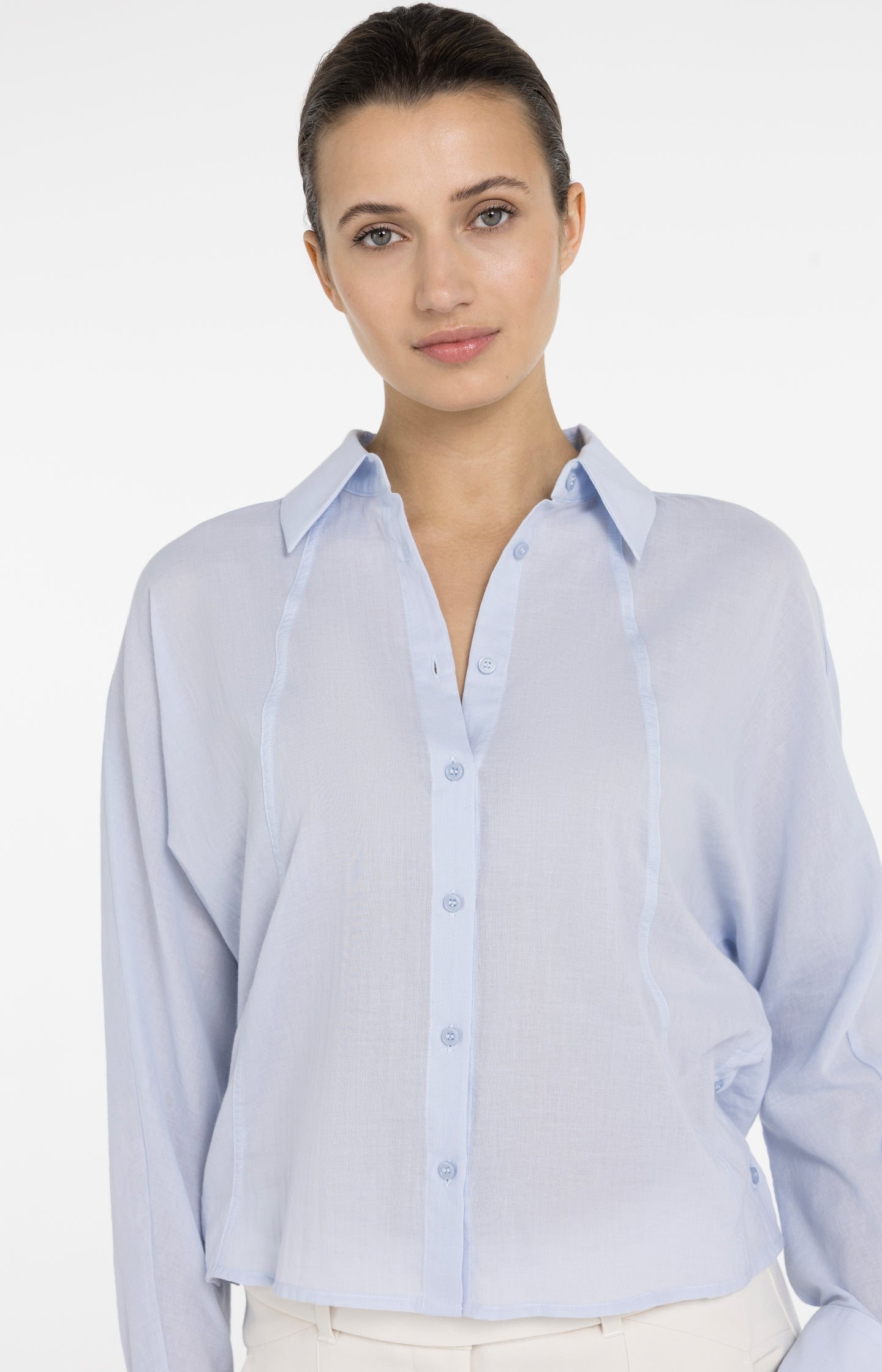 Blouse with angled seams and button details