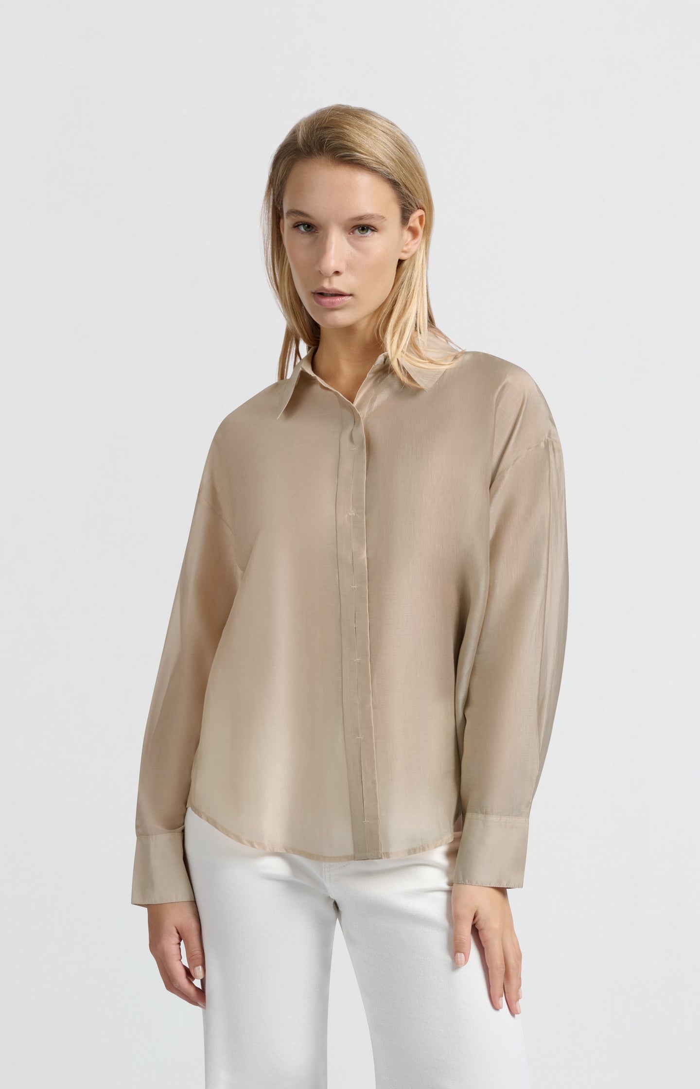 Blouse with hidden button placket and loose fit