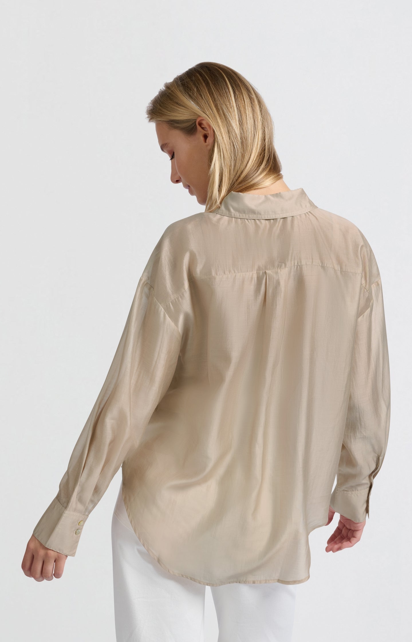 Blouse with hidden button placket and loose fit