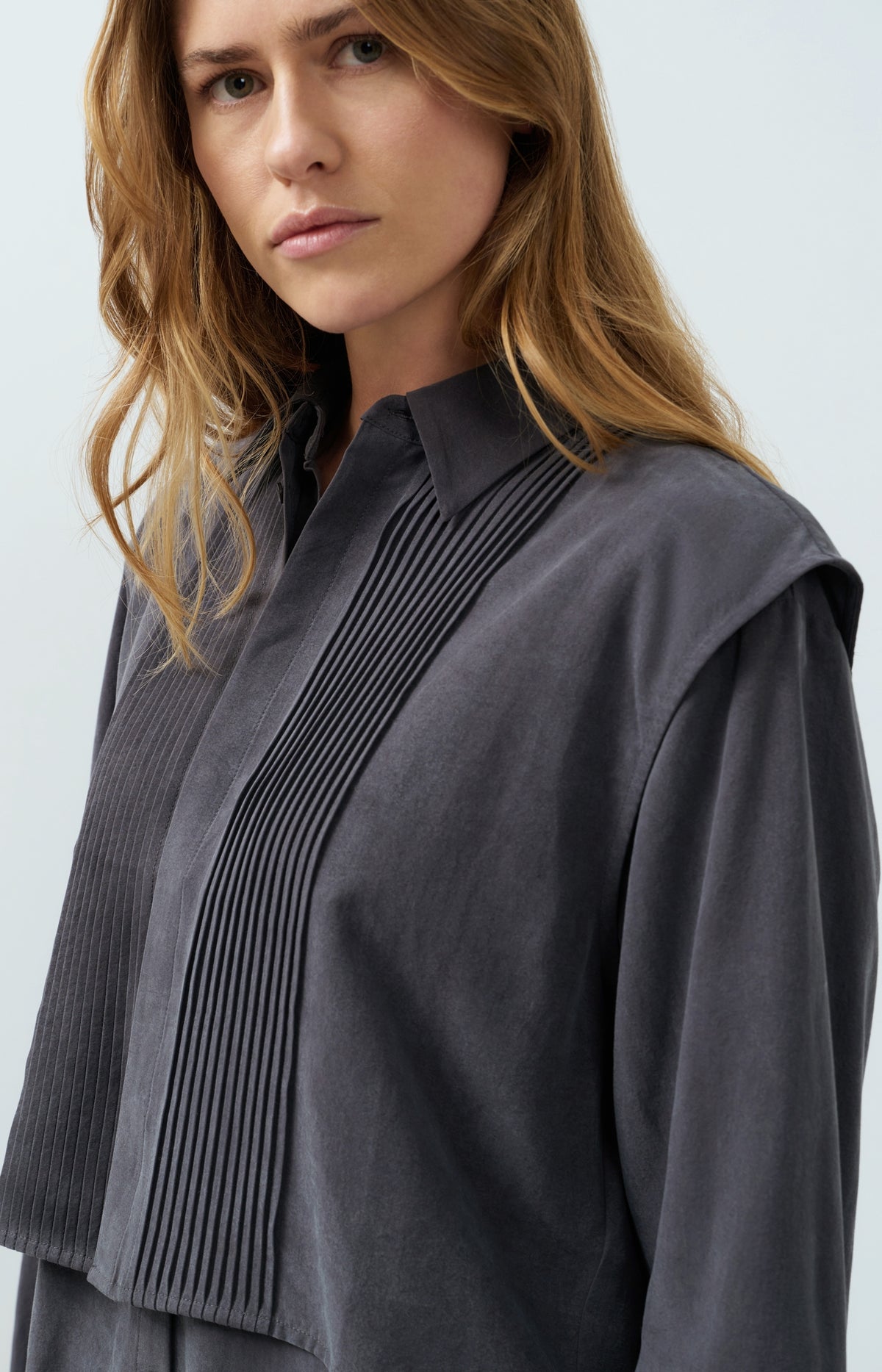 Blouse with layered gilet and pleated details
