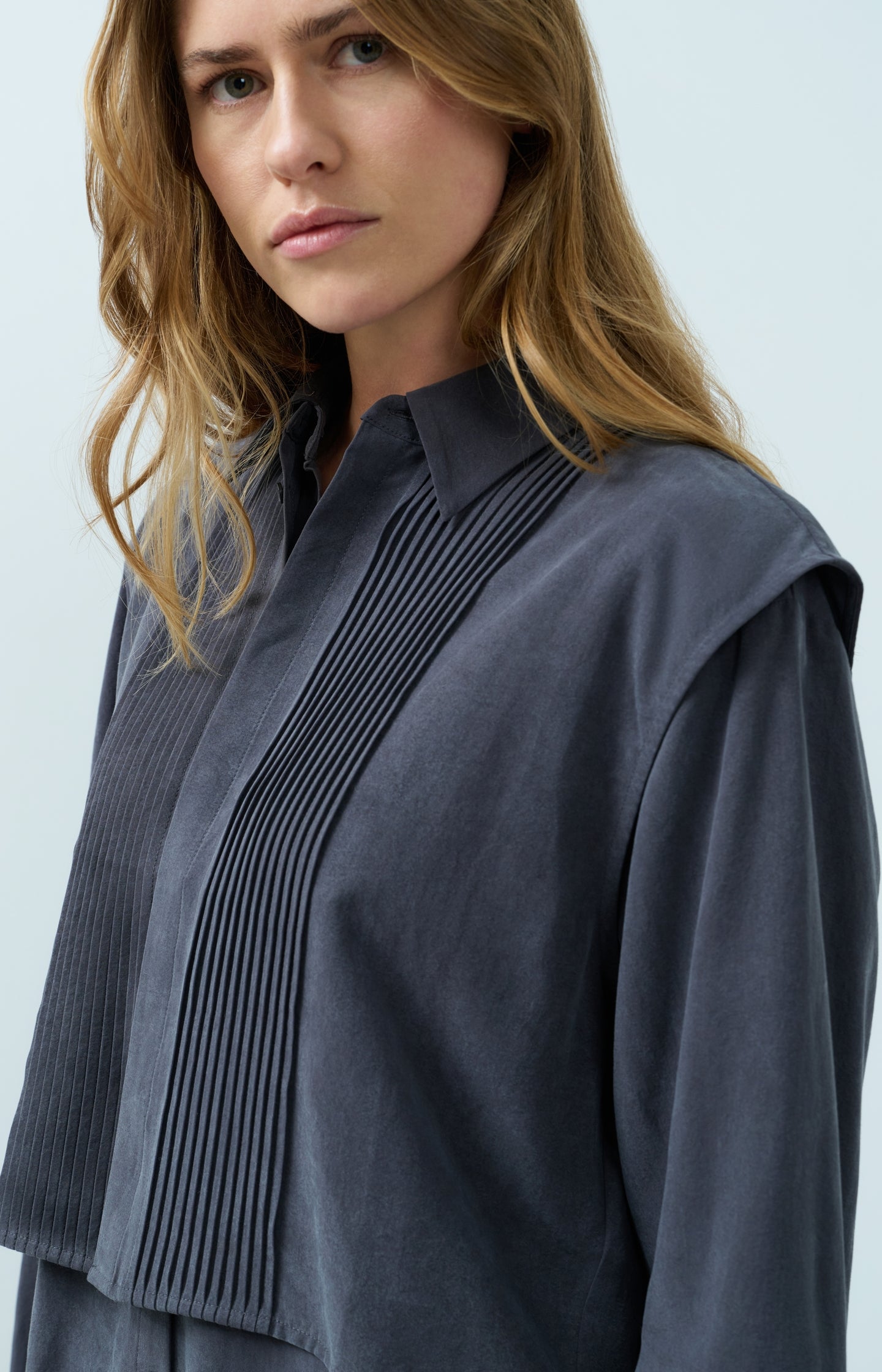 Blouse with layered gilet and pleated details