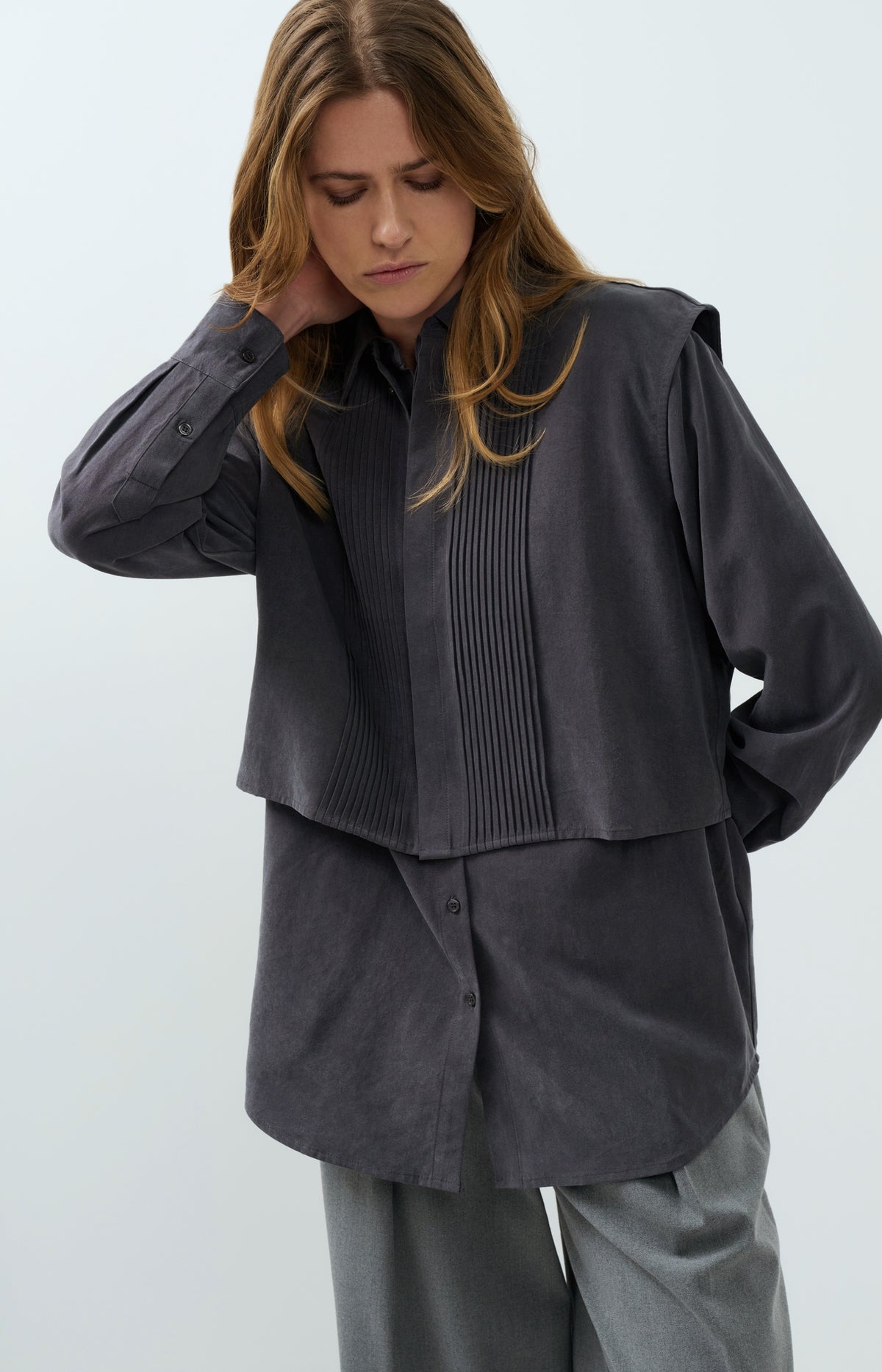 Blouse with layered gilet and pleated details