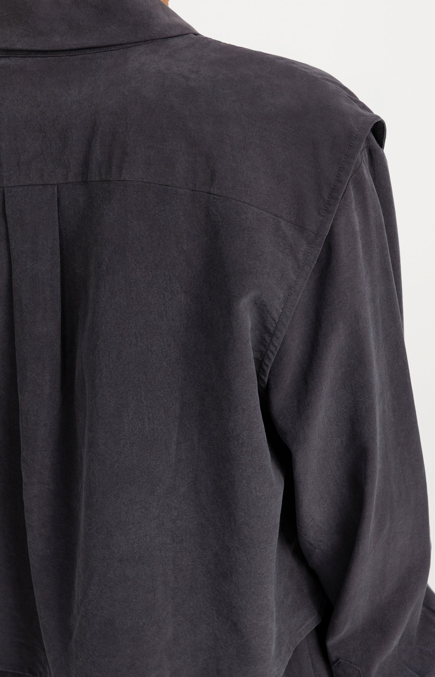 Blouse with layered gilet and pleated details