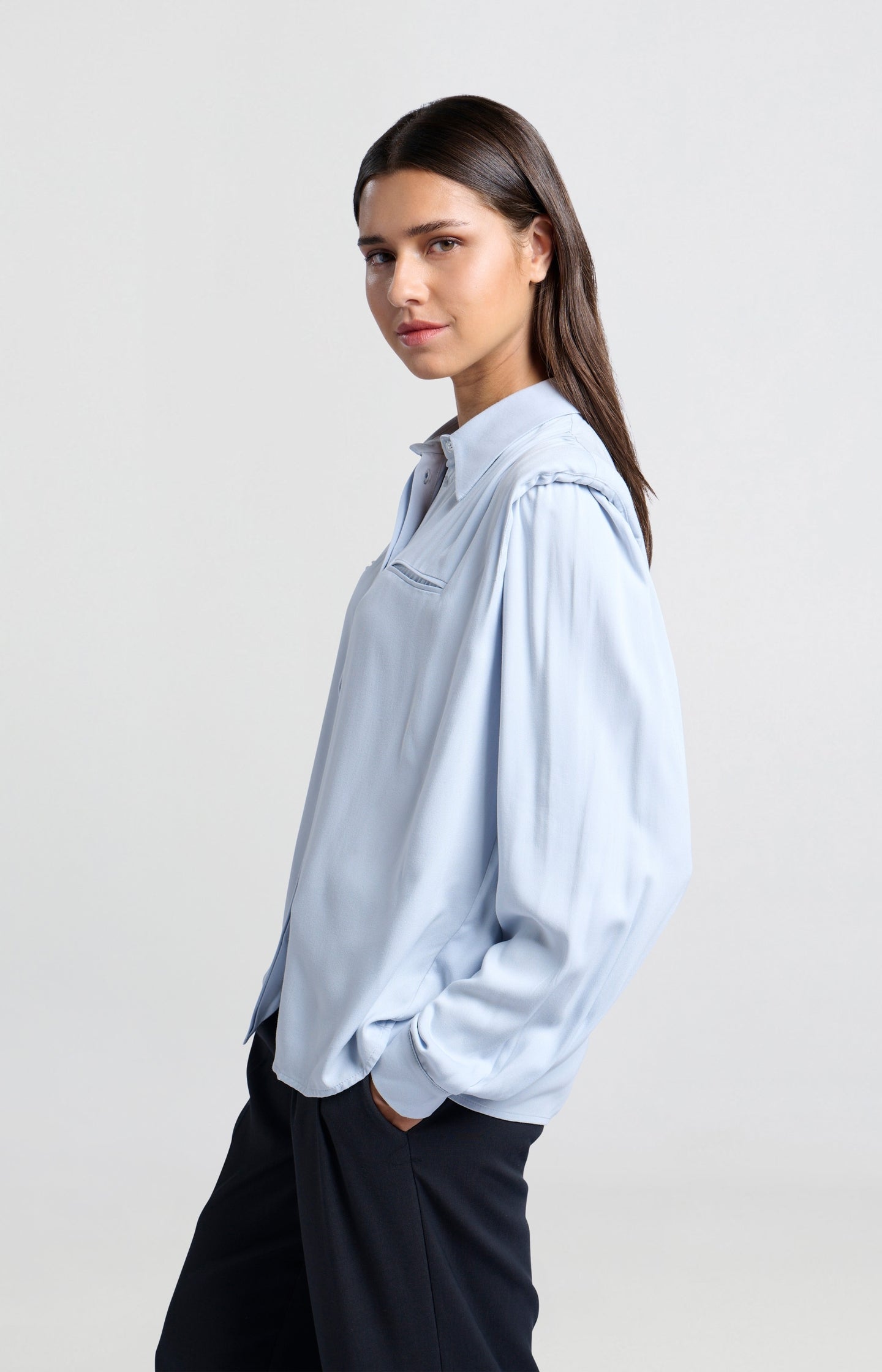 Blouse with long sleeves, buttons and shoulder pads