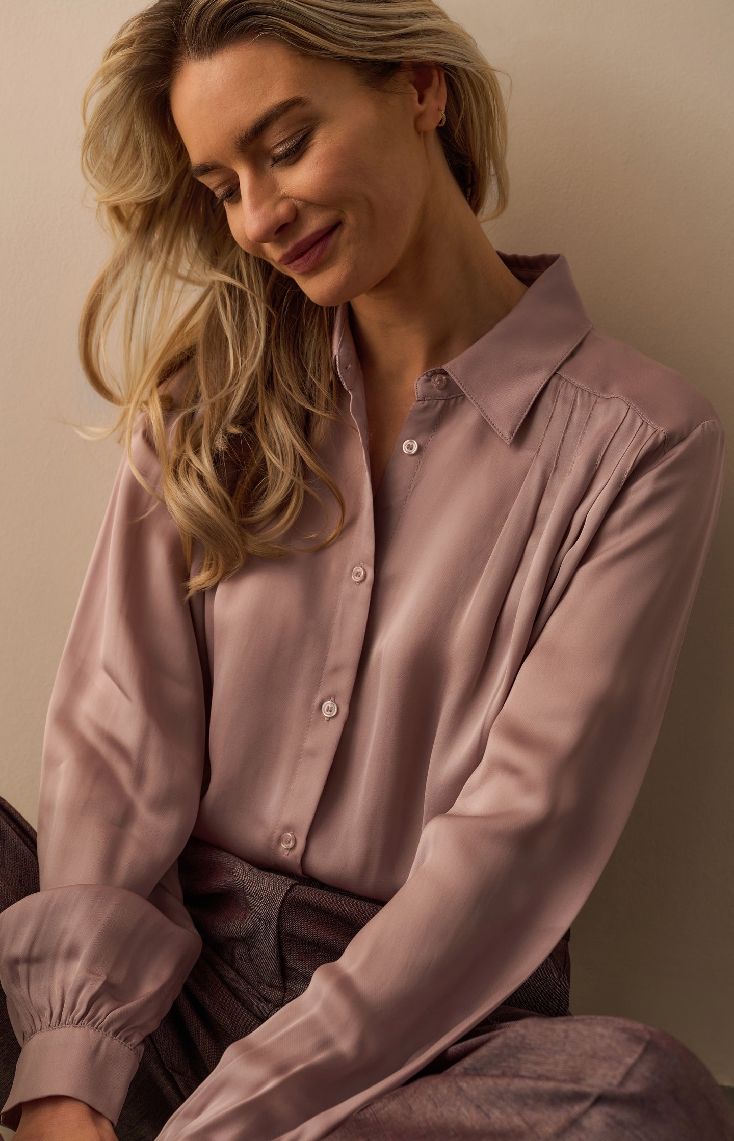 Blouse with pleated details and satin finish