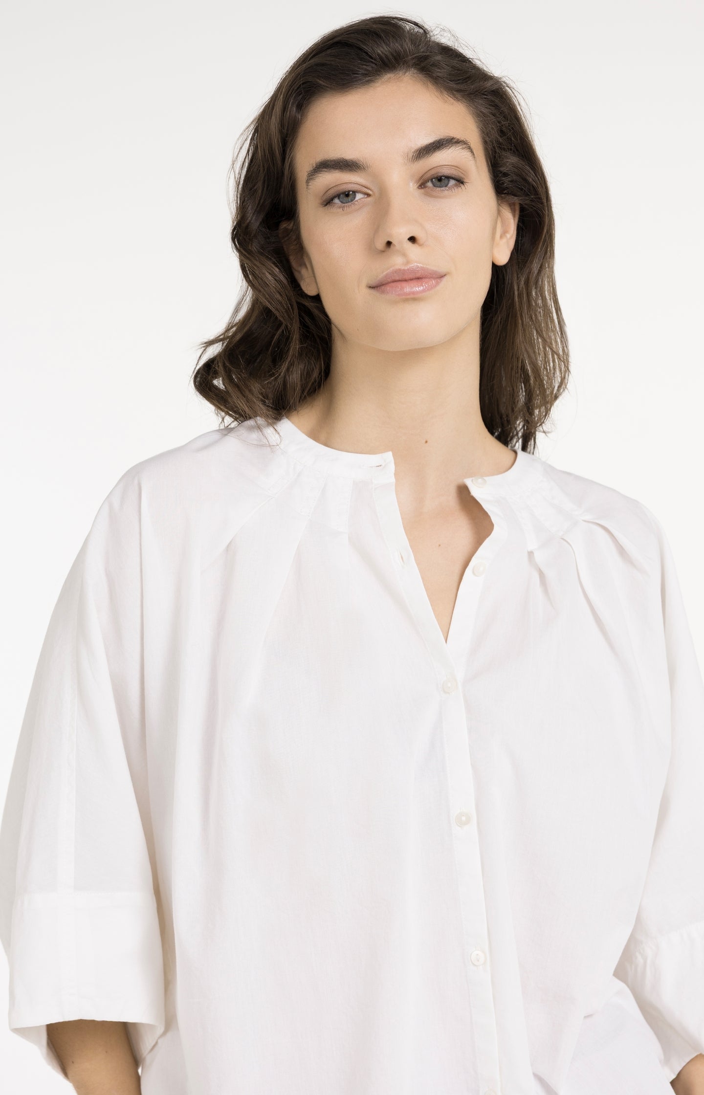 Blouse with short batwing sleeves and pleat details