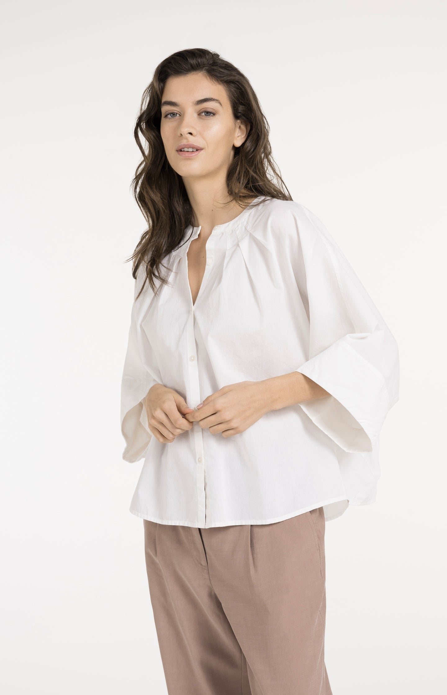 Blouse with short batwing sleeves and pleat details