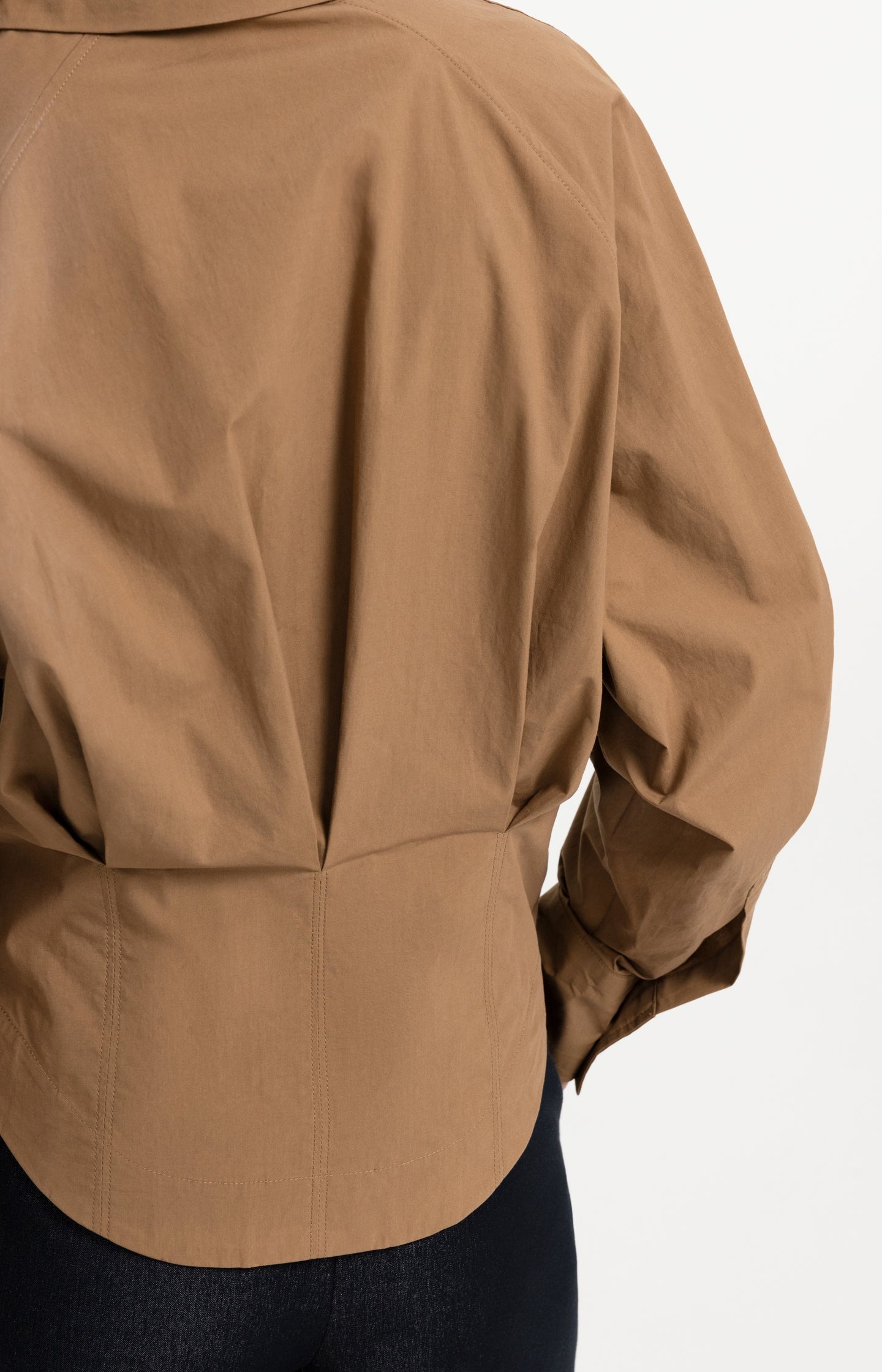 Blouse with waist accent and pleat detail
