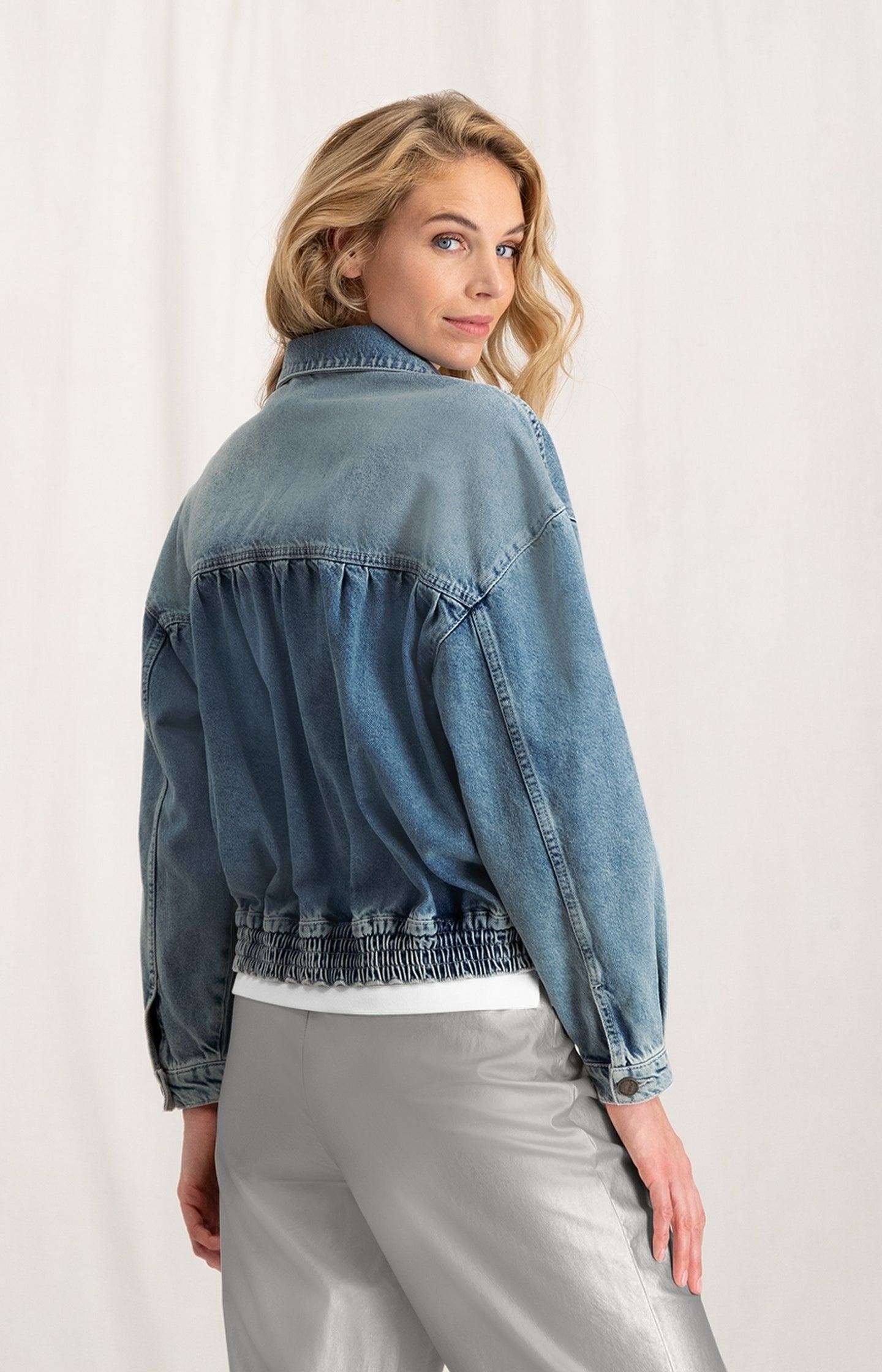 Bomber denim jacket with long sleeves, buttons and pockets