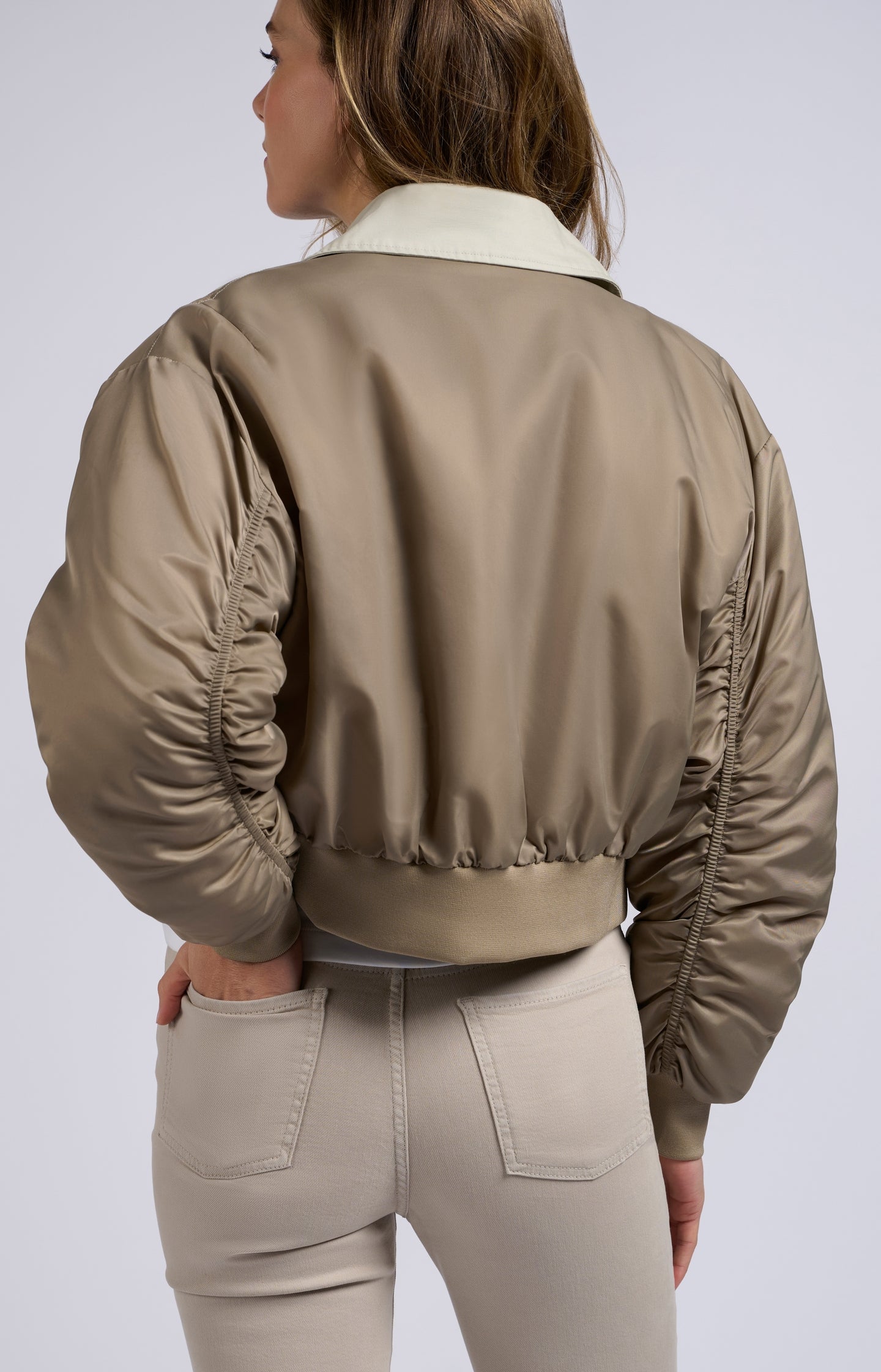 Bomber jacket with trenchcoat details and pleated sleeves