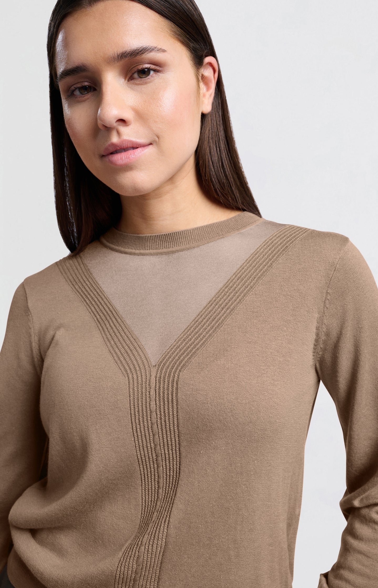 Brown sweater with transparent details and round neck