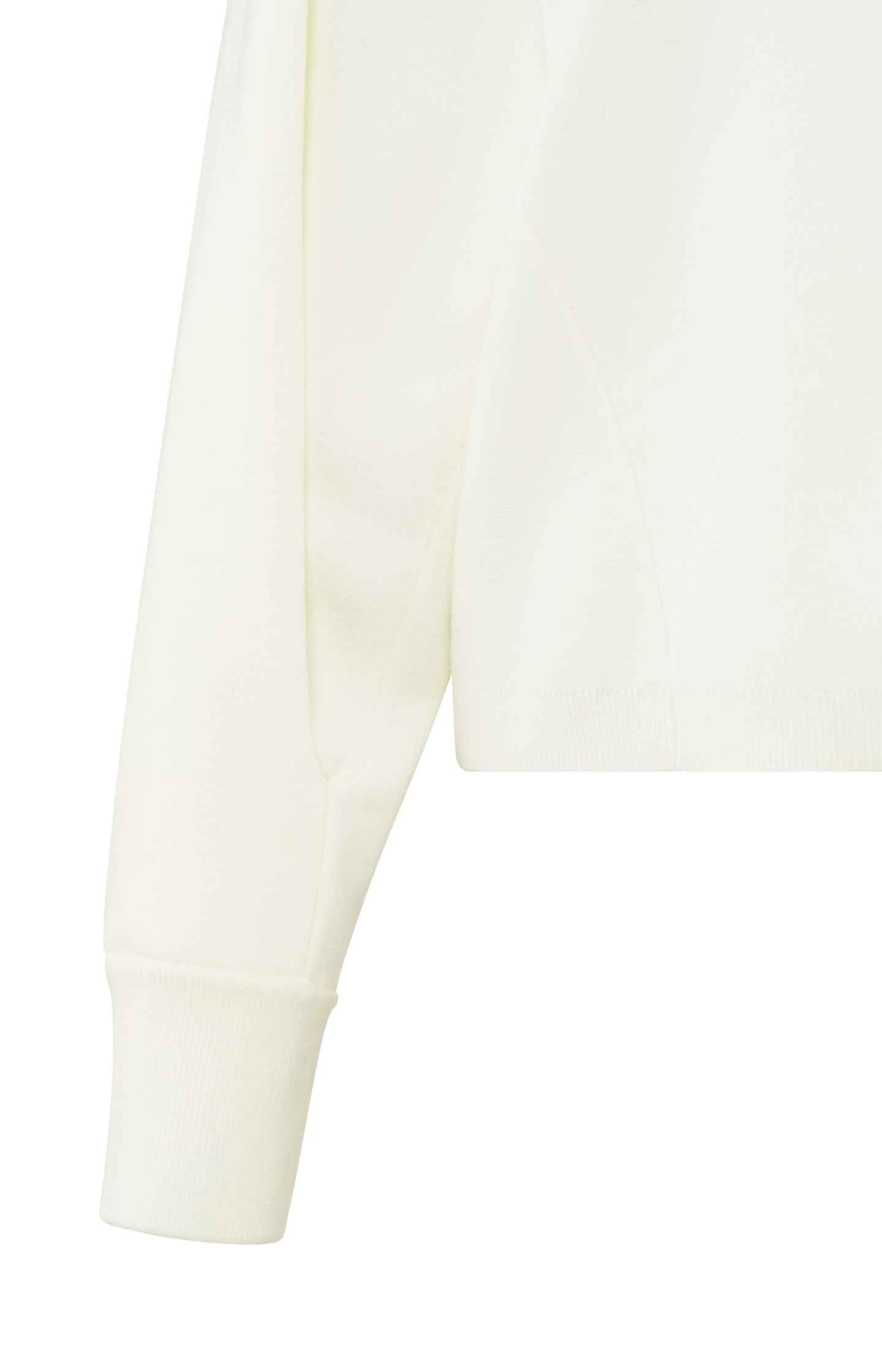 Cream-colored sweater with seam details and wide sleeves