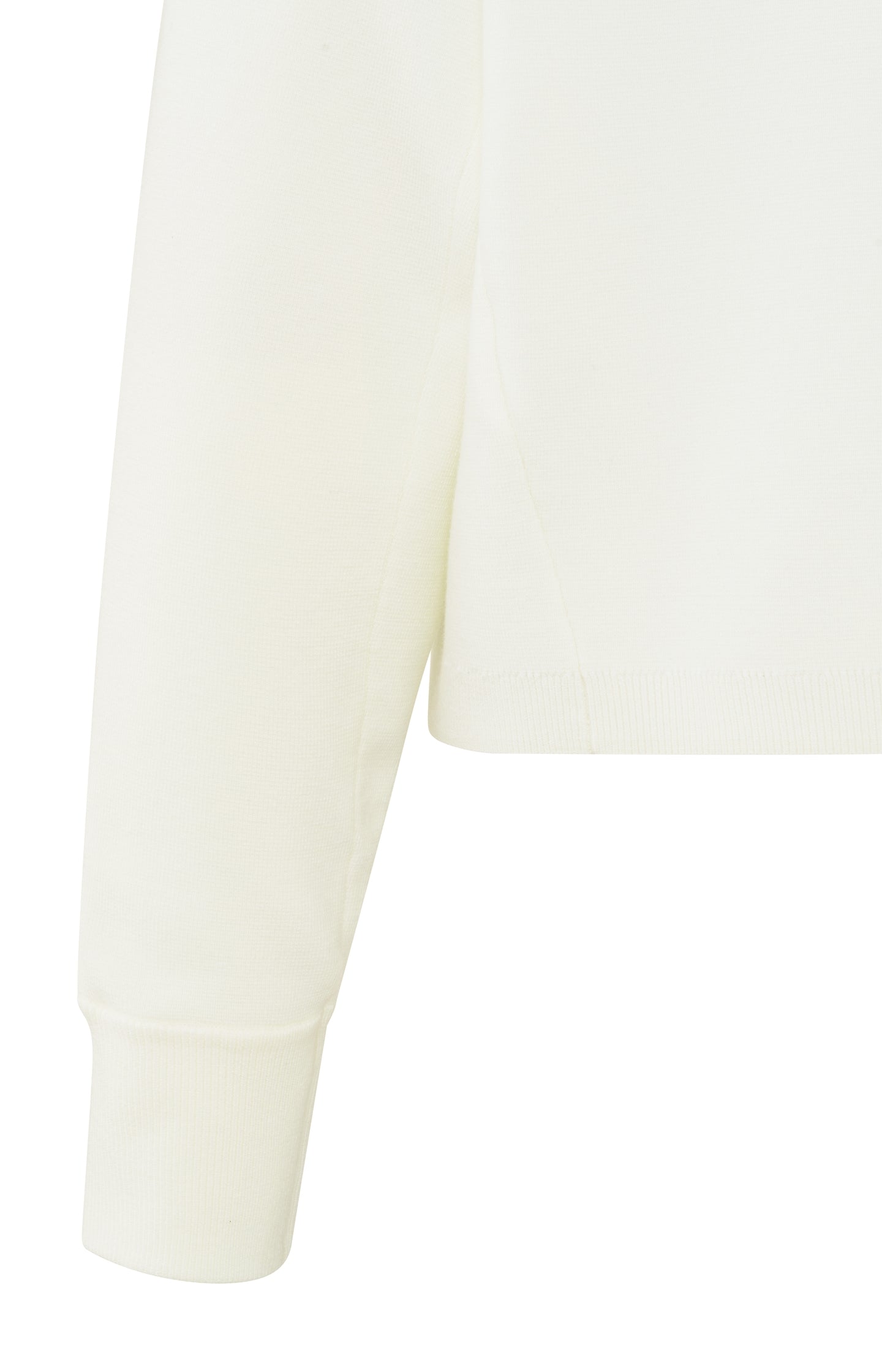 Cream-colored sweater with seam details and wide sleeves