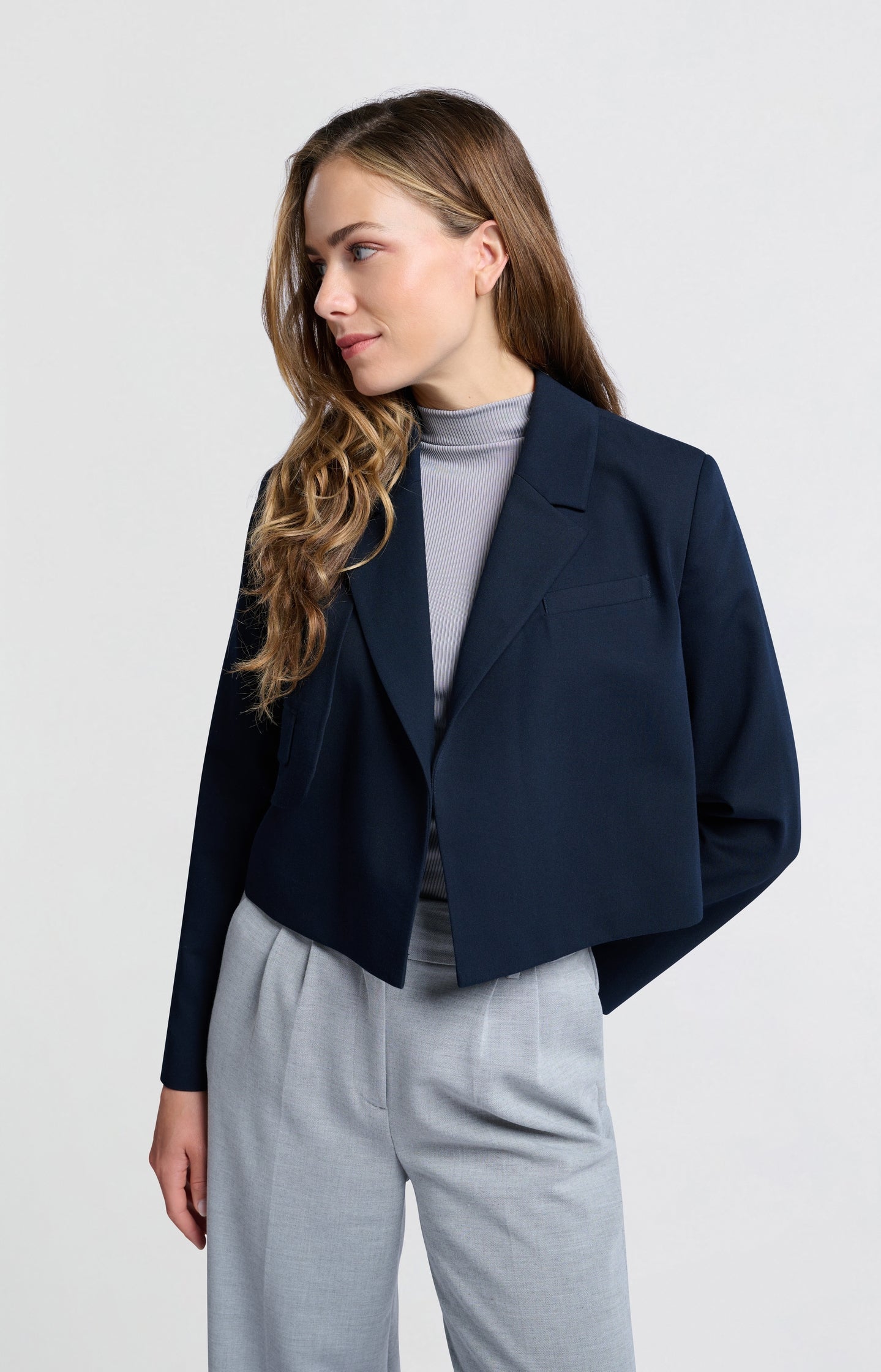 Dark blue woven cropped blazer with unique pocket detail