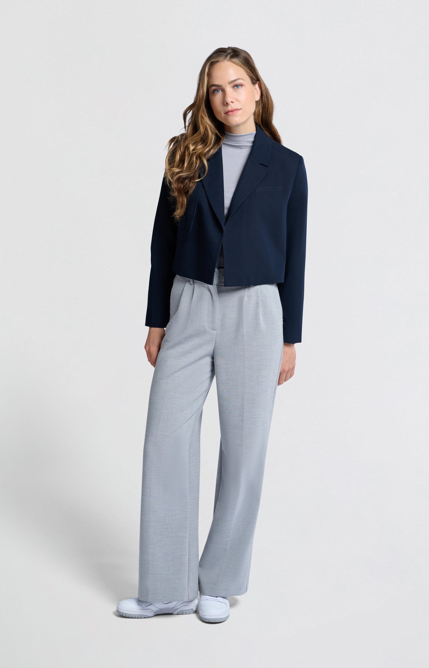 Dark blue woven cropped blazer with unique pocket detail