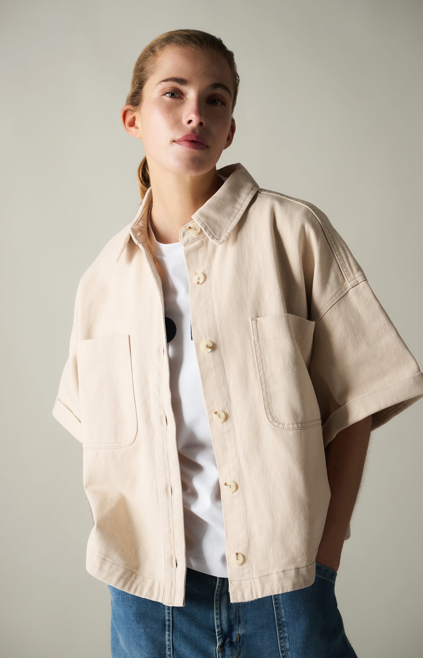 Denim jacket with short sleeves and patch pockets