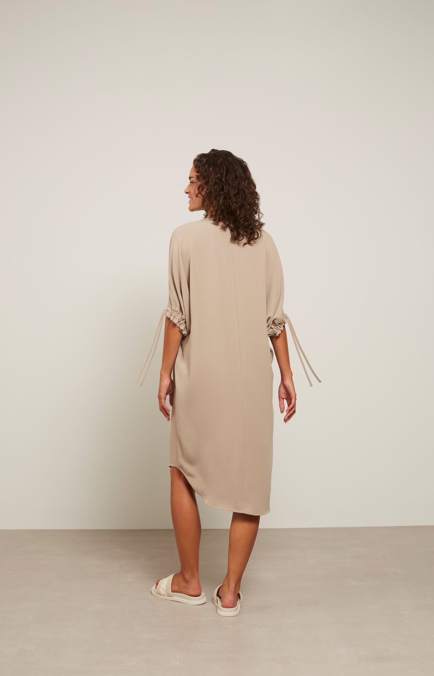 Dress with V-neck, mid-length sleeves and pleated detail