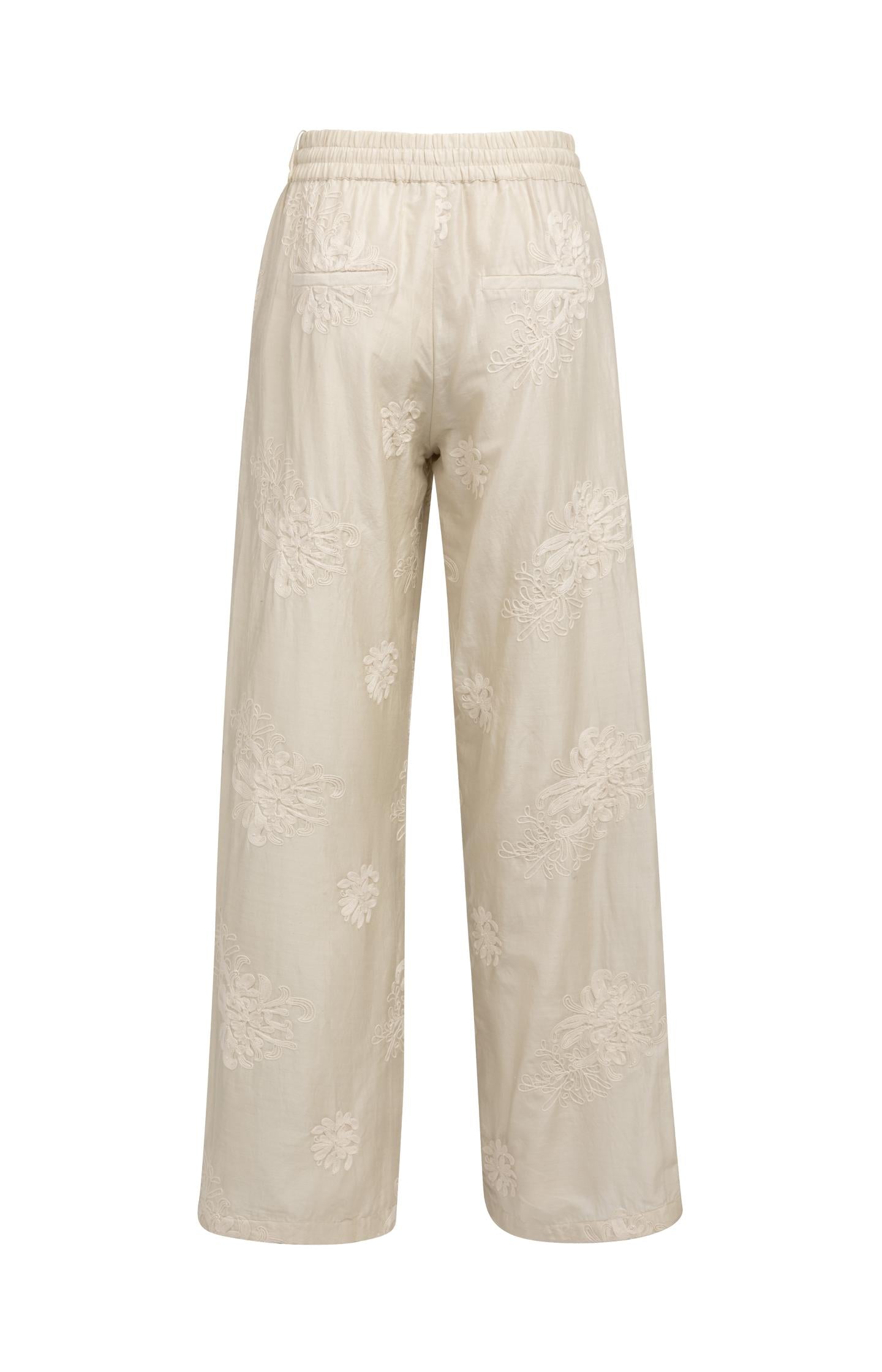 Embroidered trousers with wide legs and elastic waist