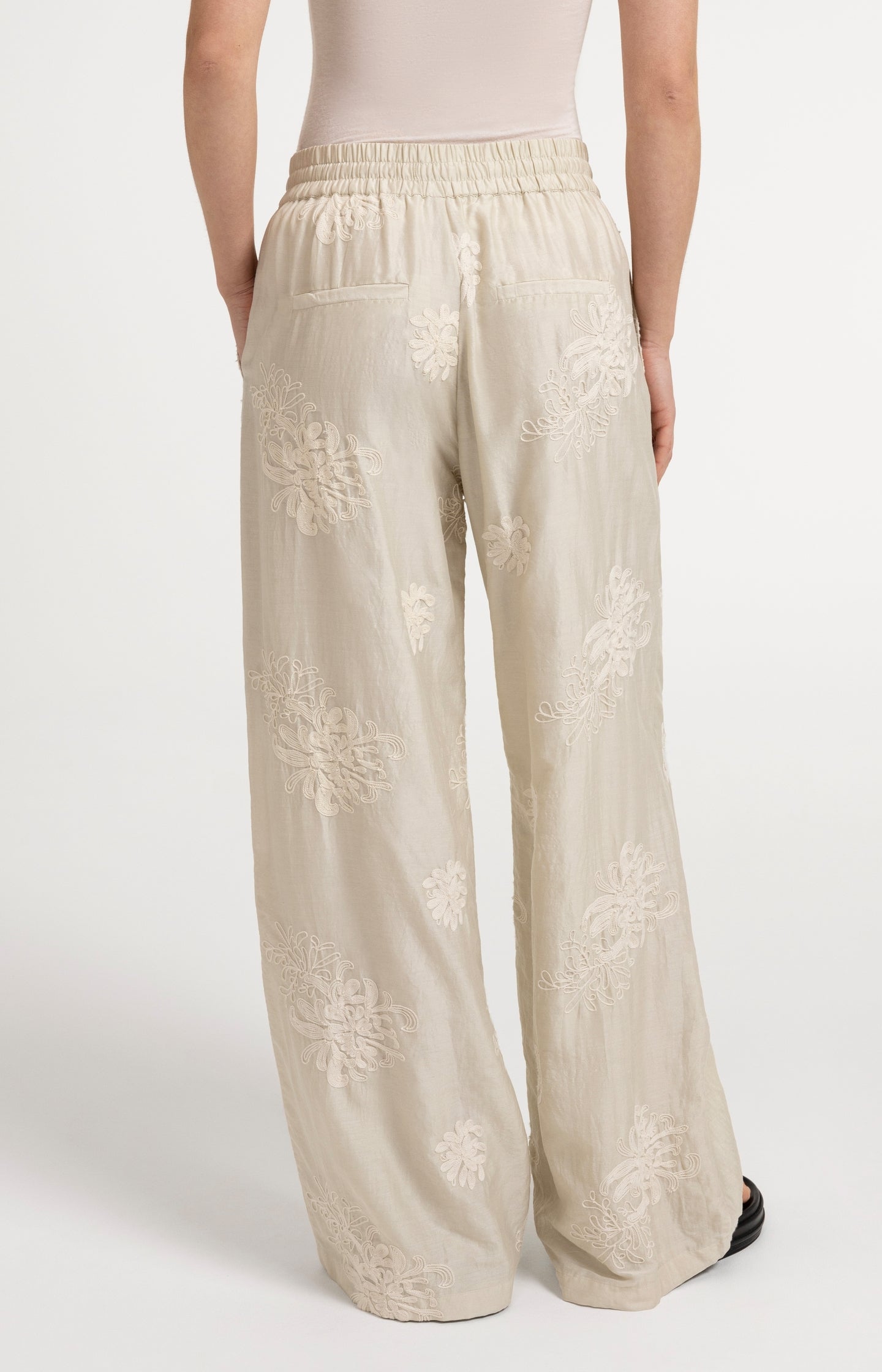 Embroidered trousers with wide legs and elastic waist