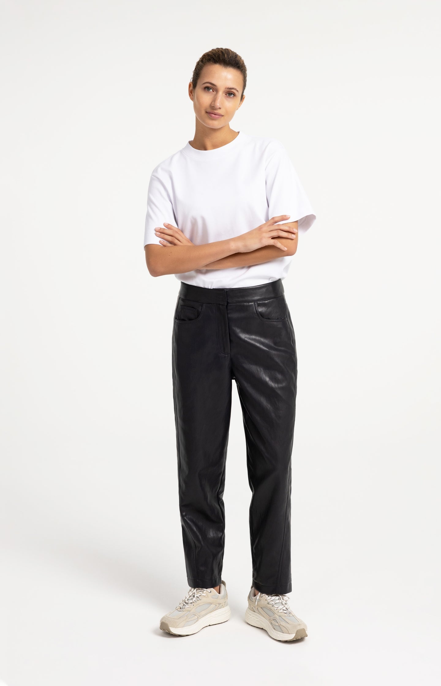 Faux leather carrot fit trousers with seam detail