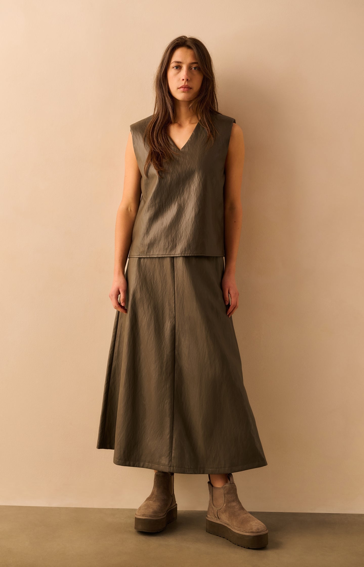 Faux leather sleeveless vest with shoulder pads