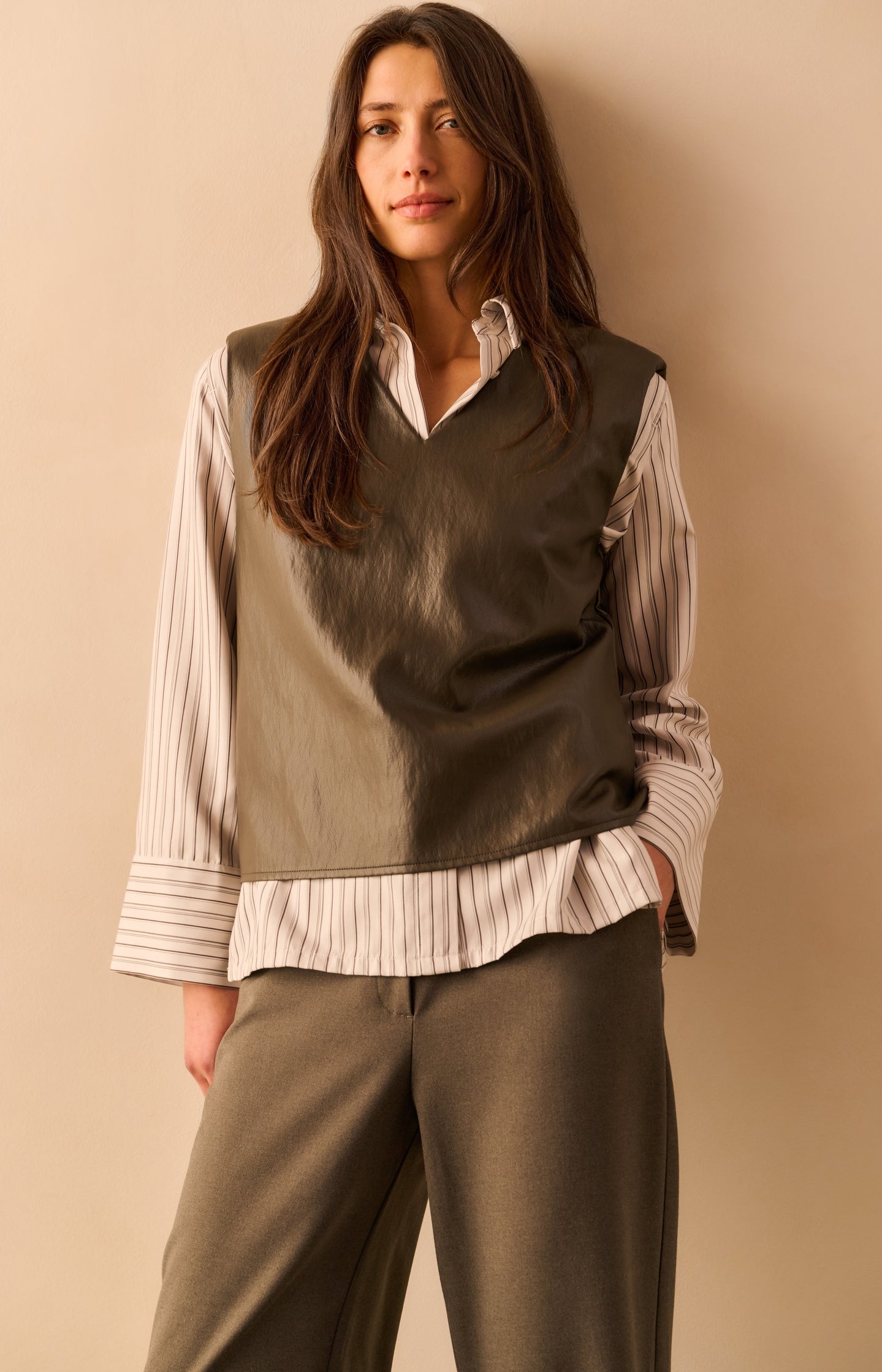 Faux leather sleeveless vest with shoulder pads