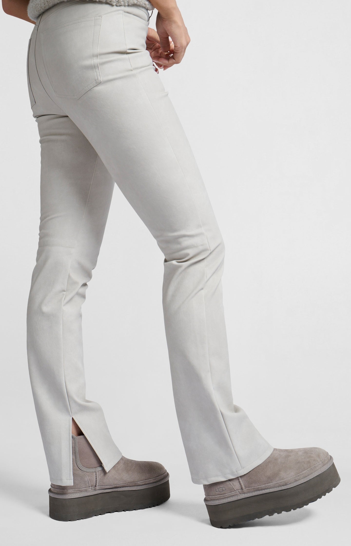 Faux nubuck leather pants with high waist, pockets and slit