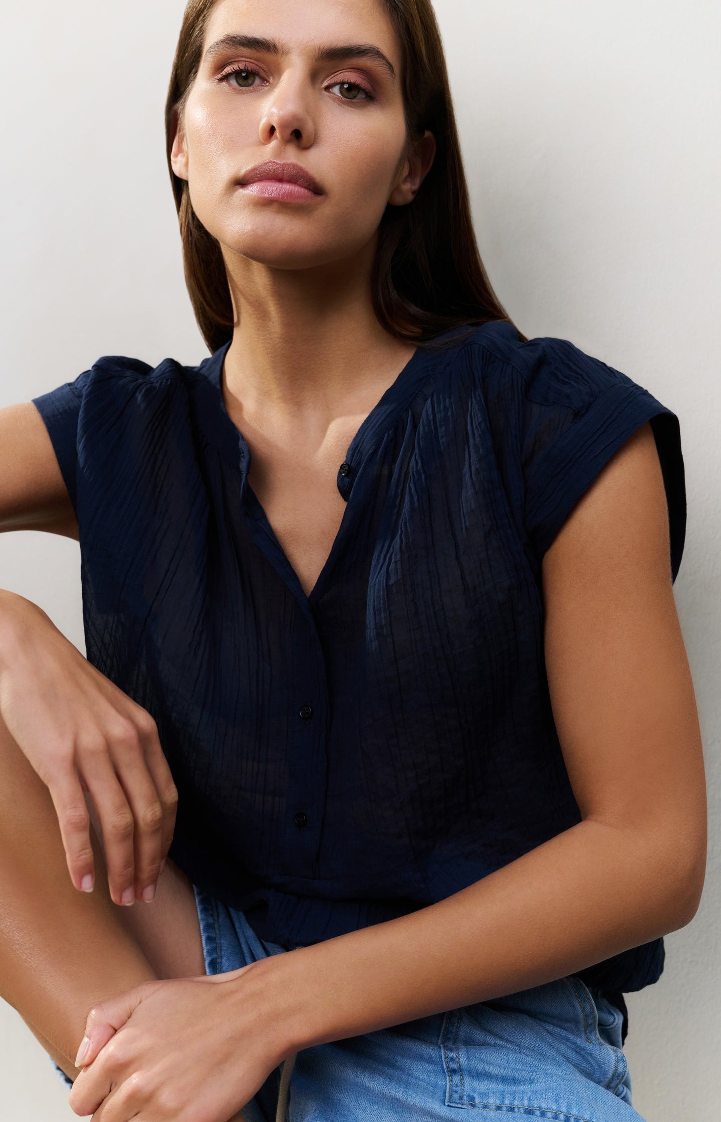 Flowy blouse with polo collar and cap sleeves